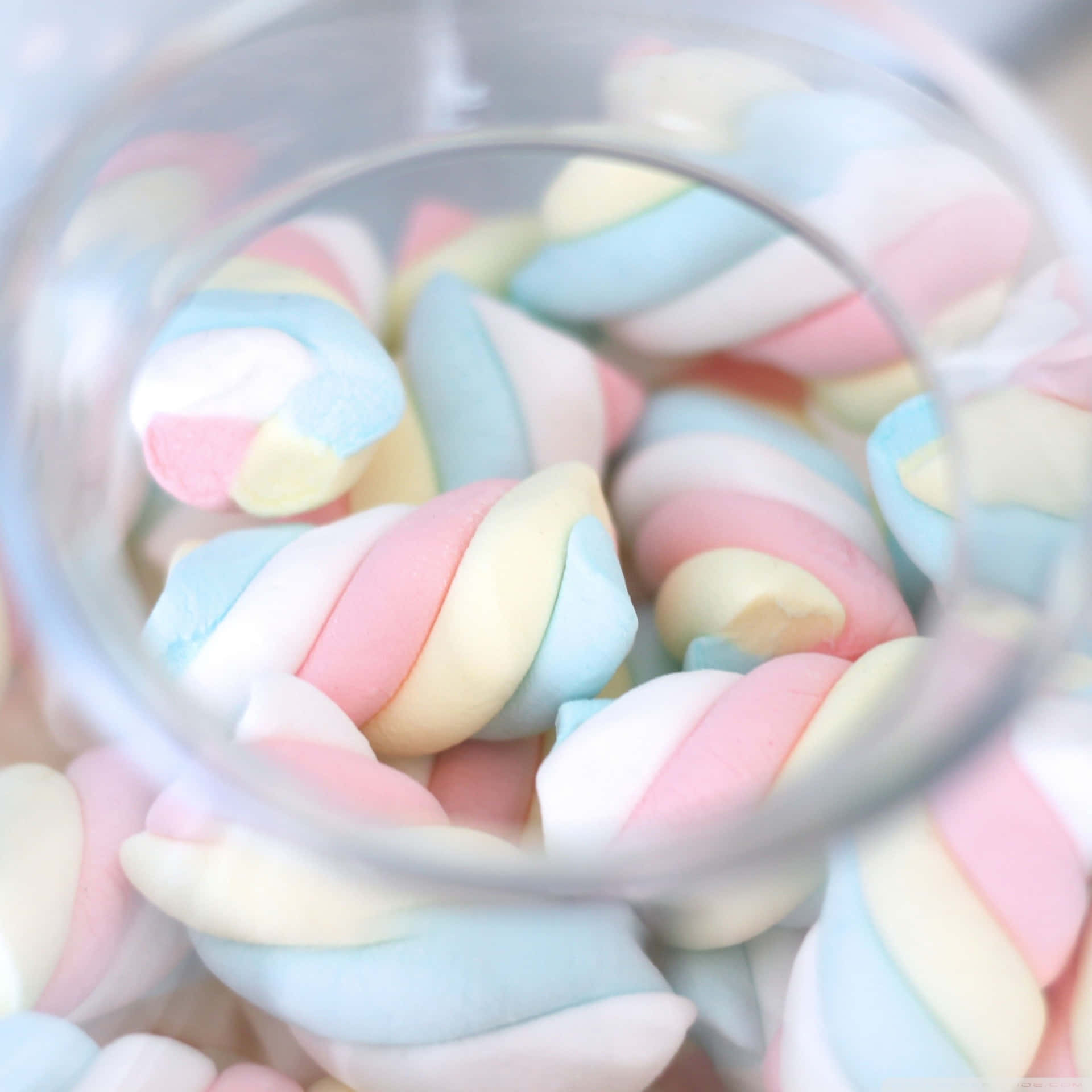 A Glass Bowl Filled With Colorful Marshmallows