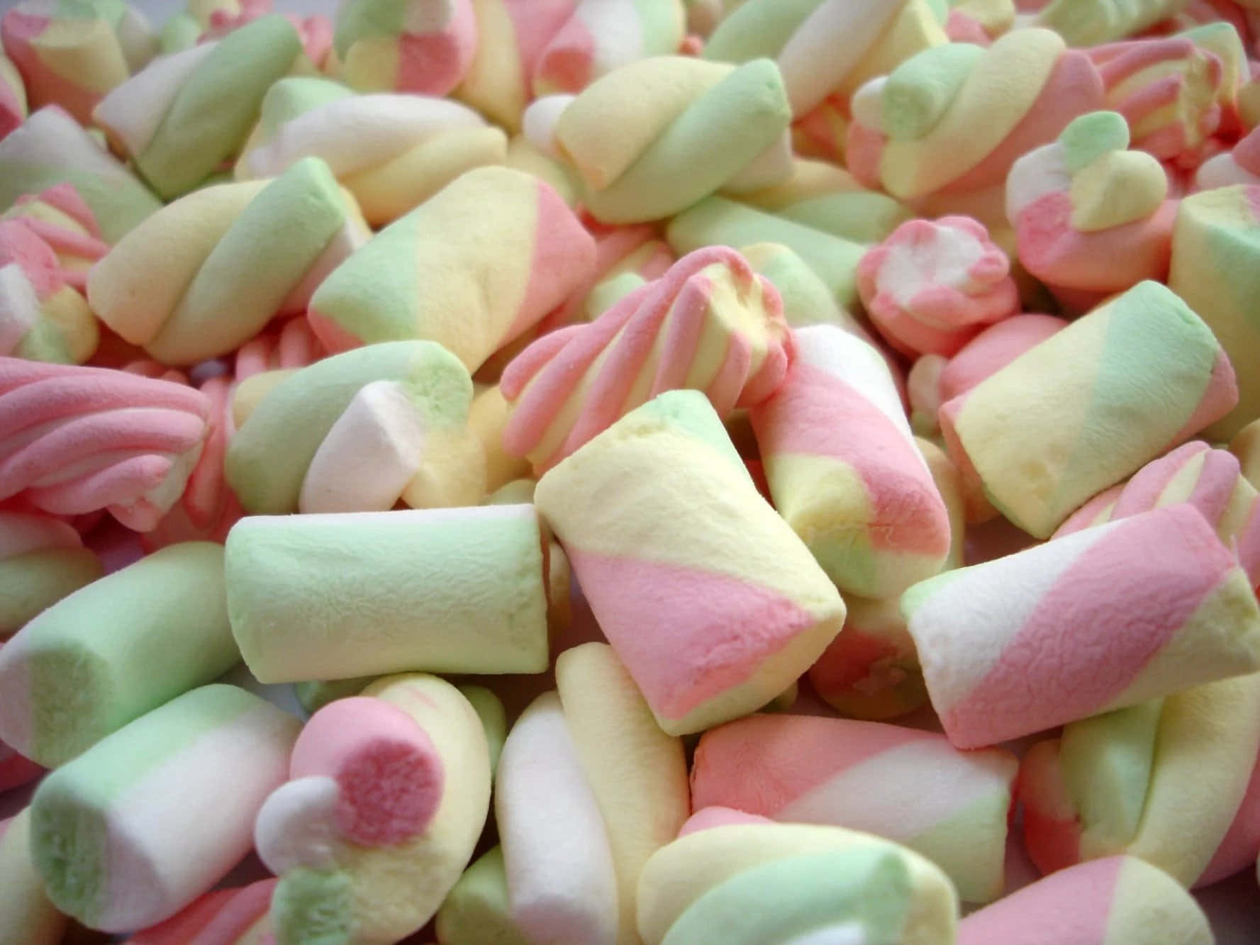 A Pile Of Pink And Green Marshmallows