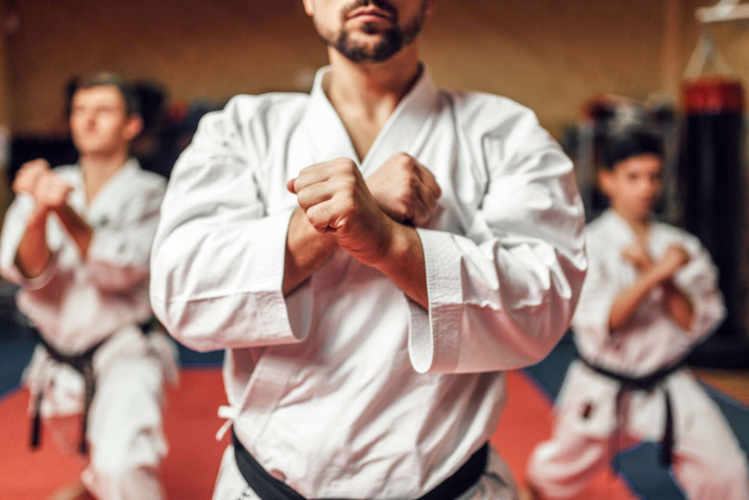 Martial artist wearing a crisp white uniform in action Wallpaper