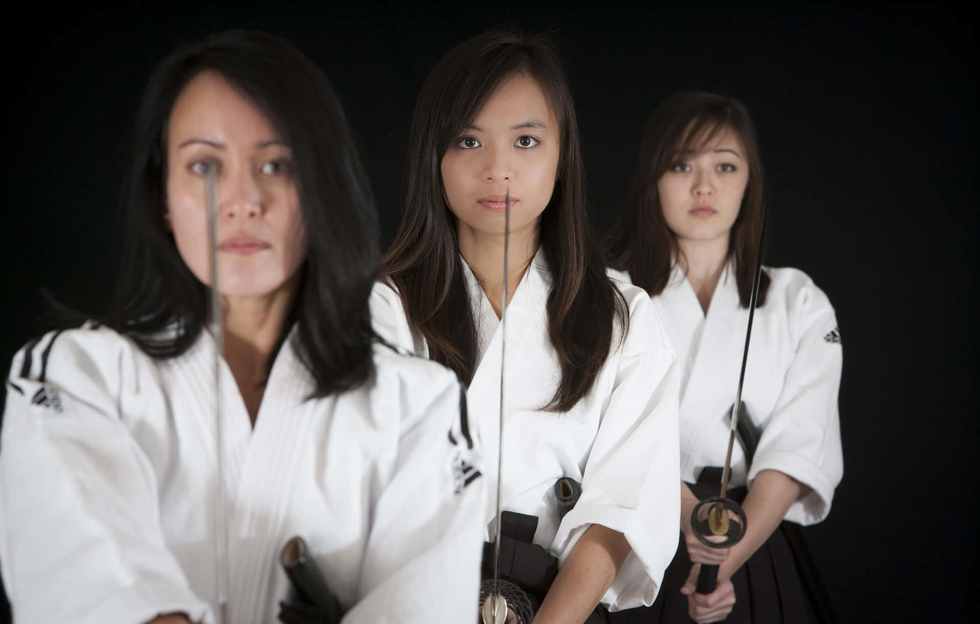 Martial Arts Expert Poised for Action in Uniform Wallpaper