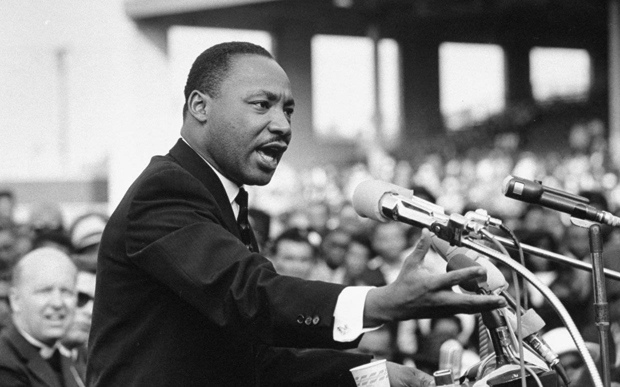 Martin Luther King Jr Speaking In Front Of Crowd Wallpaper