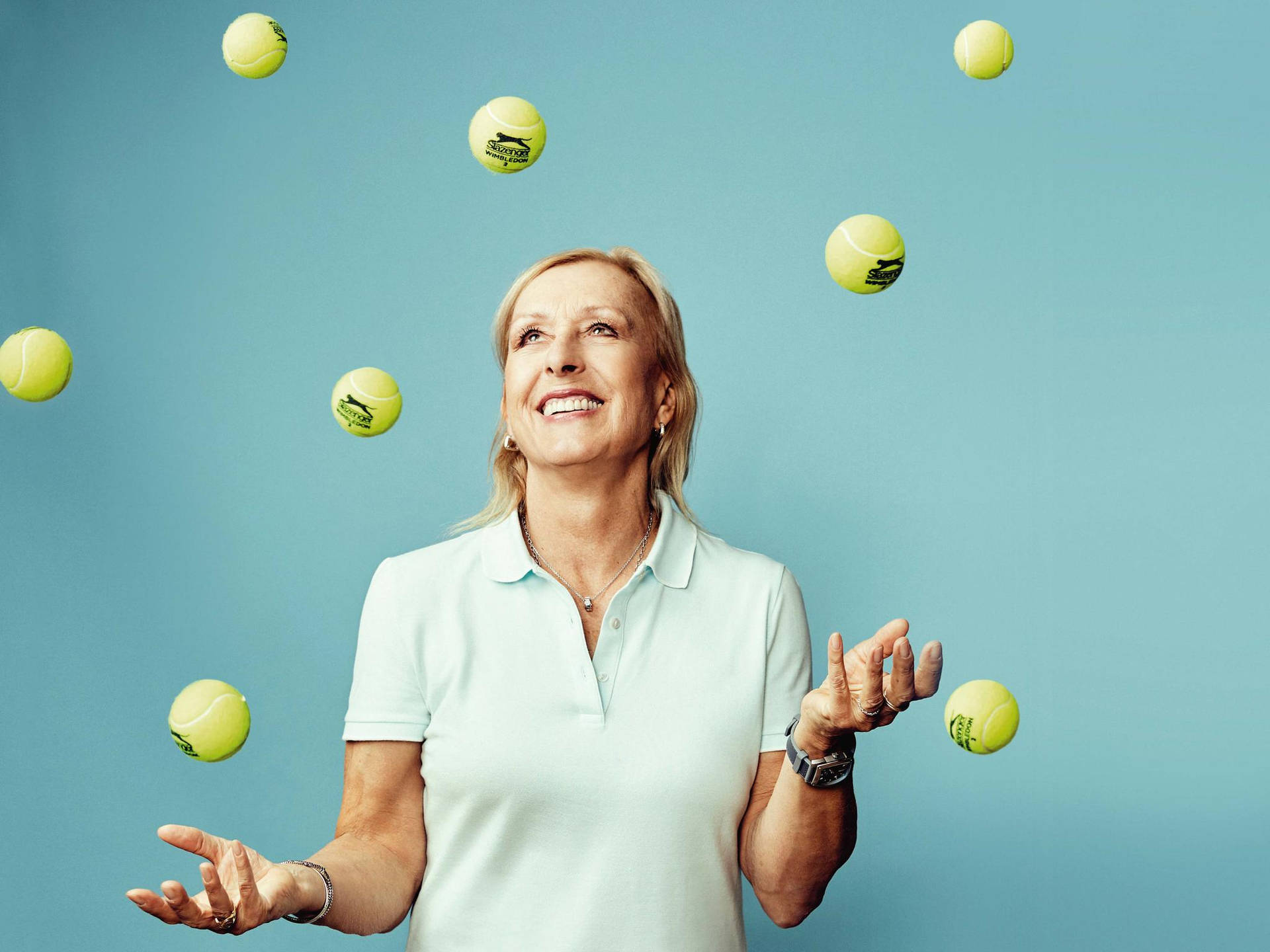 Martina Navratilova Surrounded By Tennis Balls Wallpaper