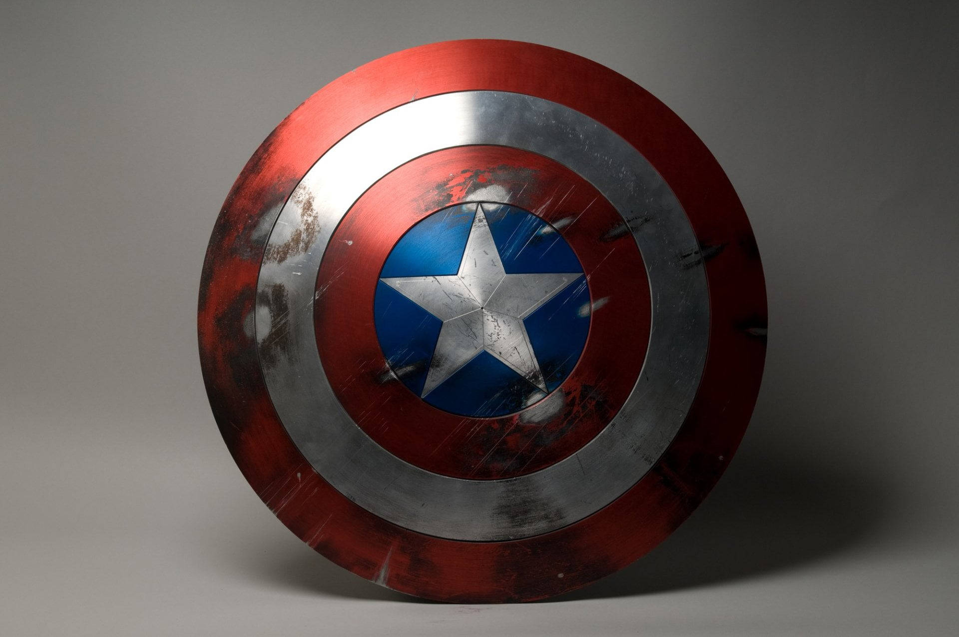 Captain America holding his iconic shield ready to take on the world Wallpaper