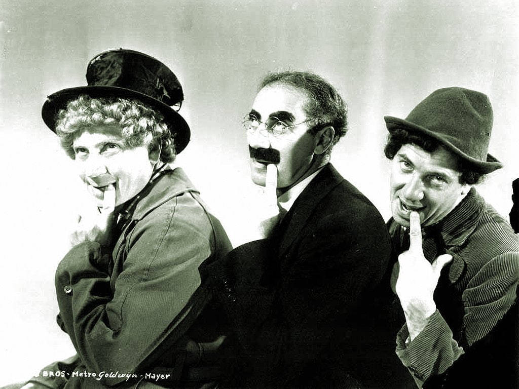 The Marx Brothers in a Playful Moment Wallpaper
