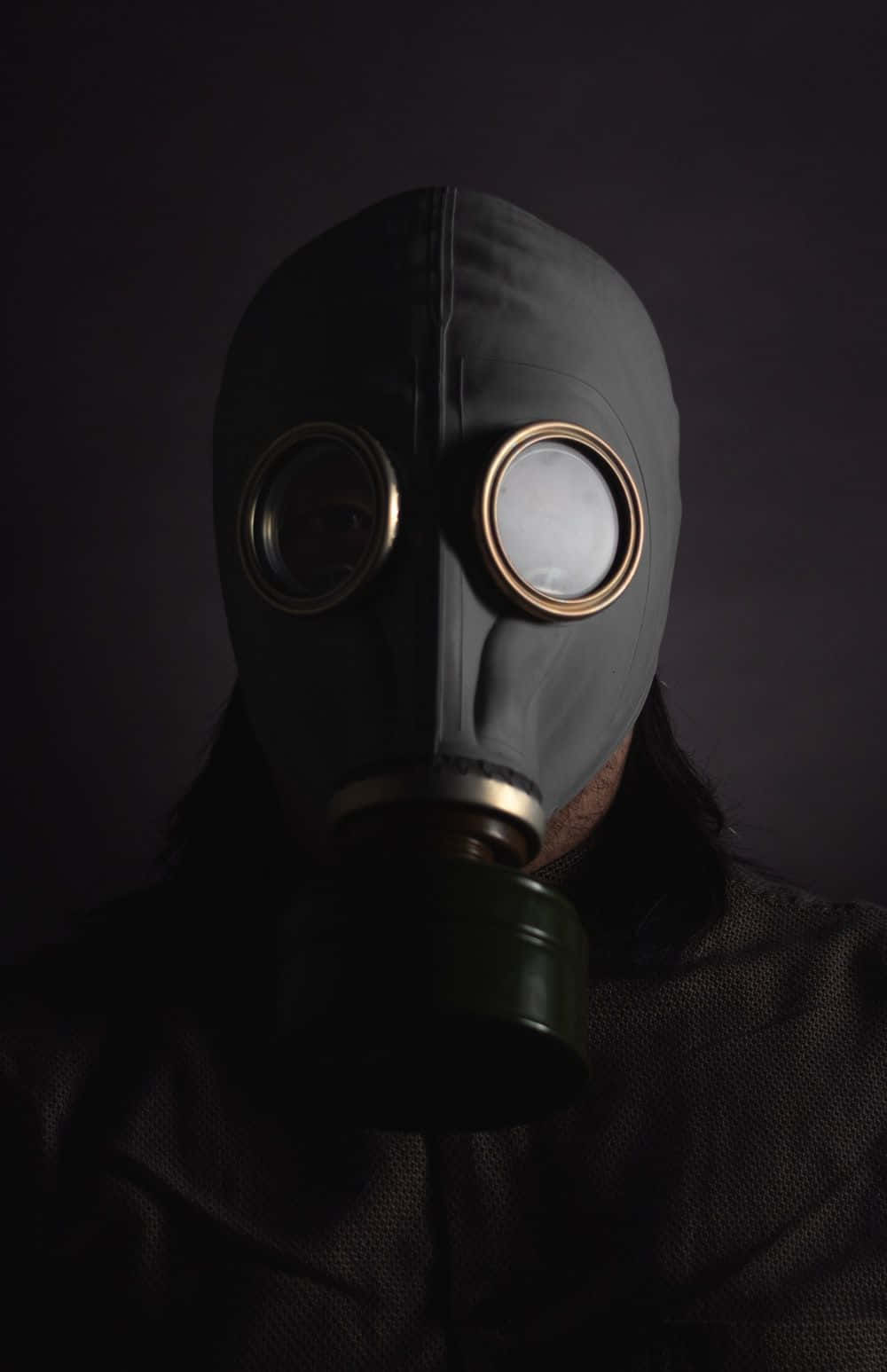 A Man In A Gas Mask On A Dark Background
