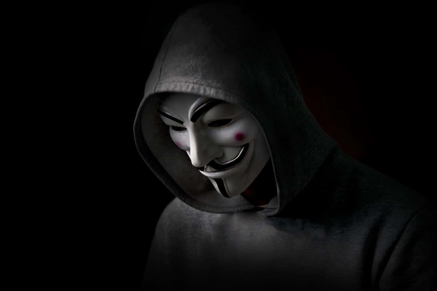 Enman I En Luva Med En V För Vendetta-mask