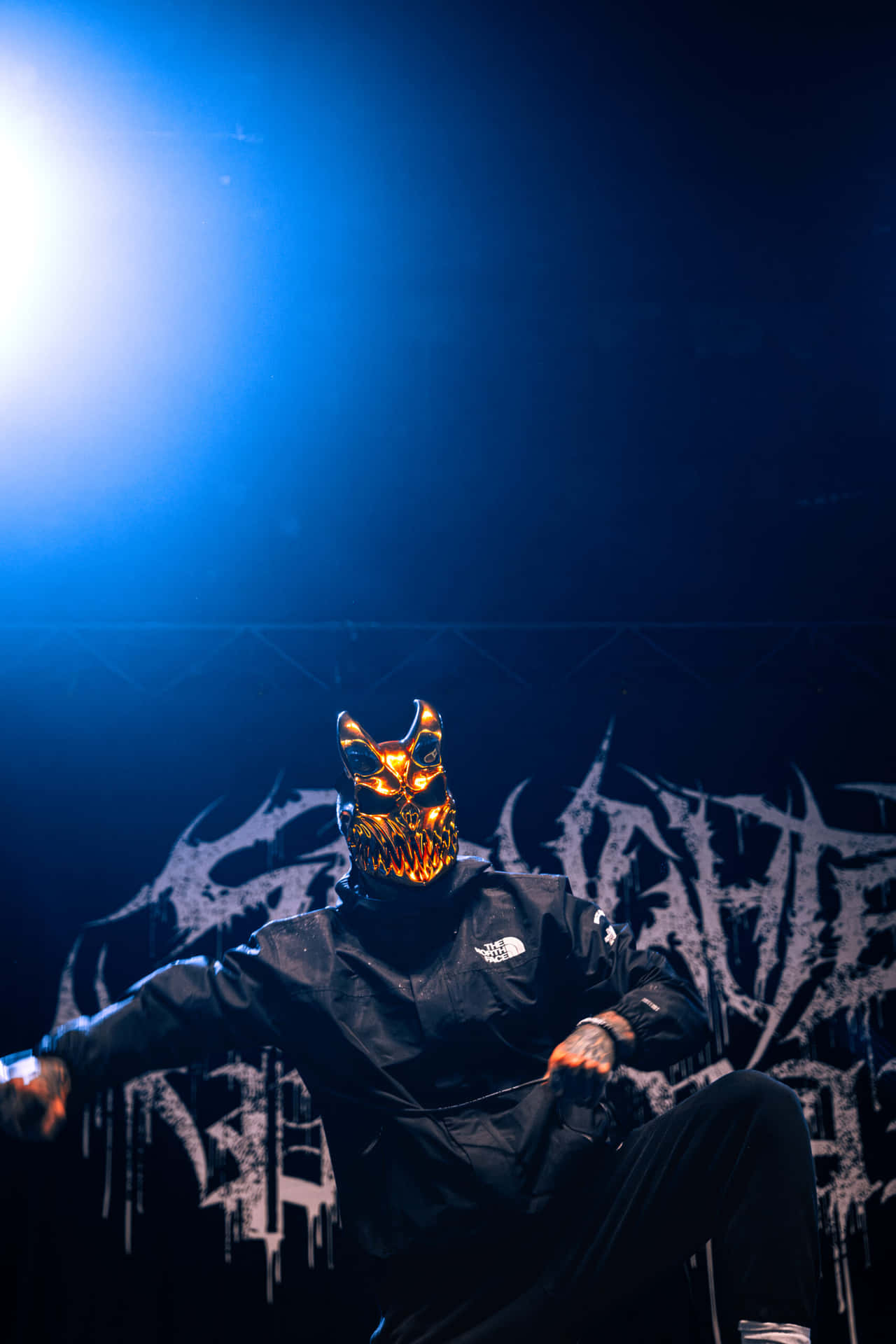 Masked_ Metal_ Performer_on_ Stage.jpg Wallpaper