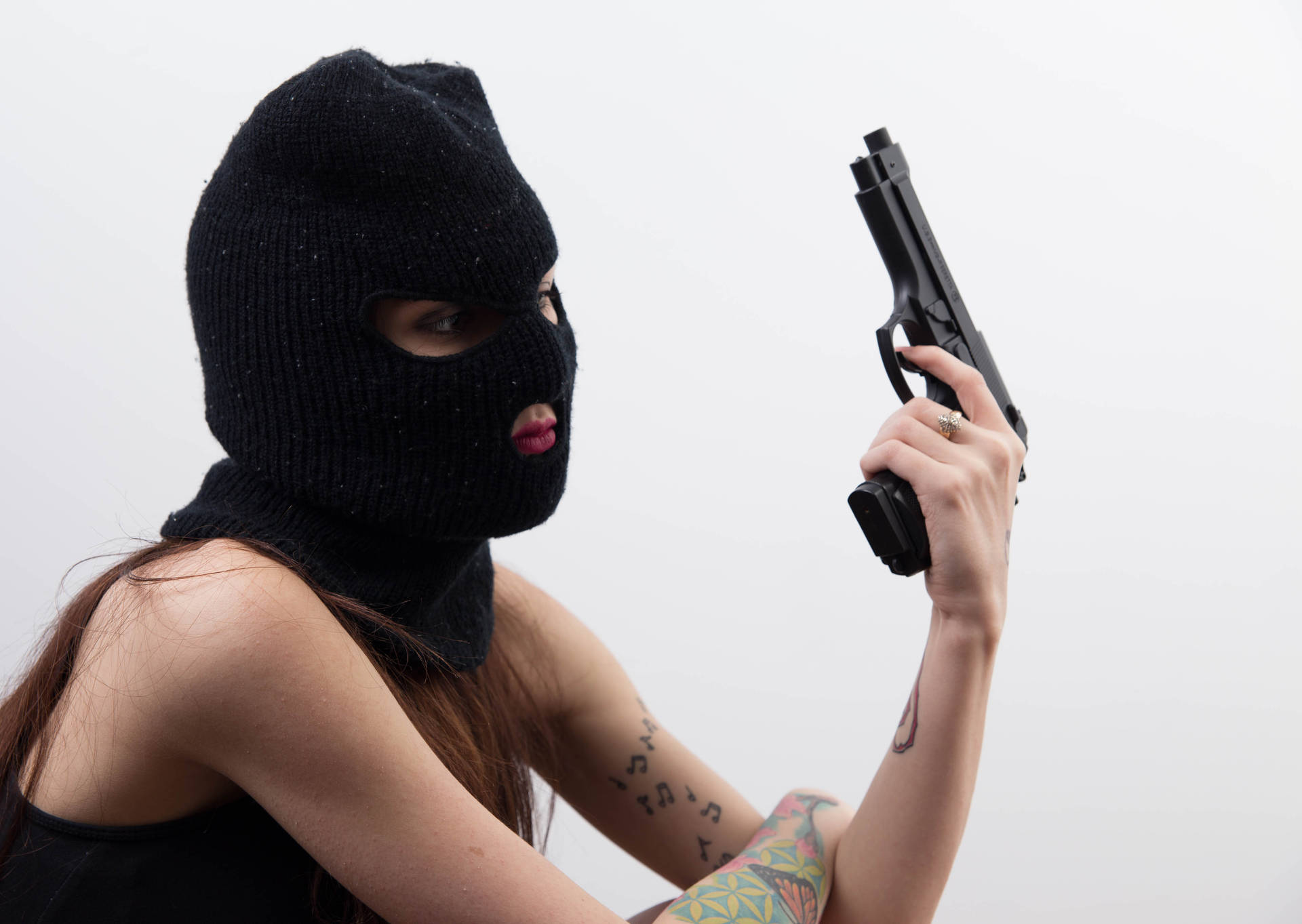 Masked Woman With A Gun Wallpaper