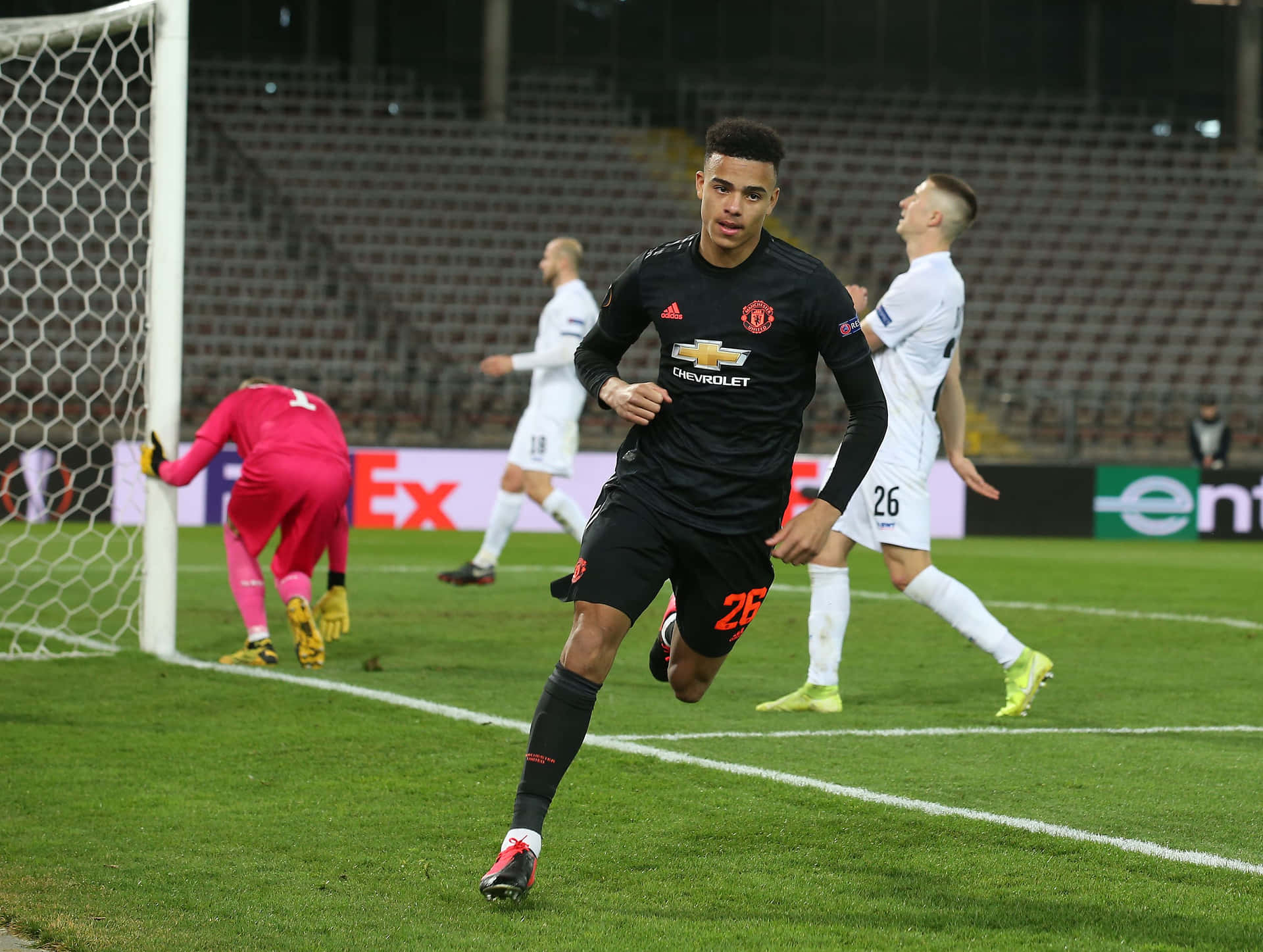 Mason Greenwood unleashes a powerful shot during a match