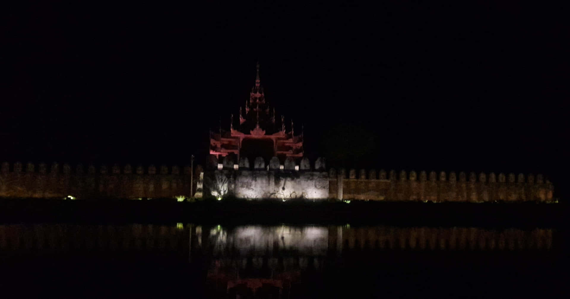 Masonry Screens Of Mandalay Palace At Night Wallpaper