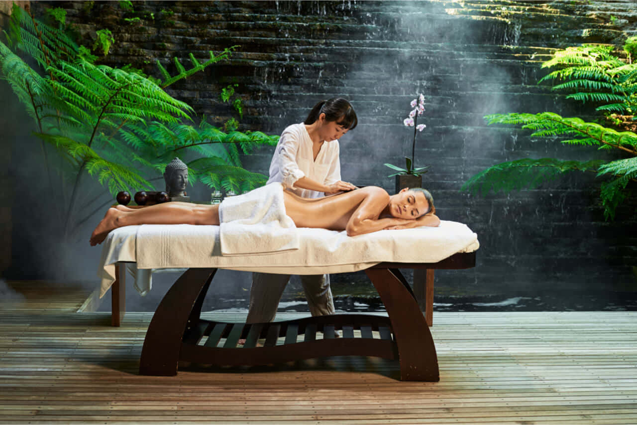 A Woman Getting A Massage In A Spa Wallpaper