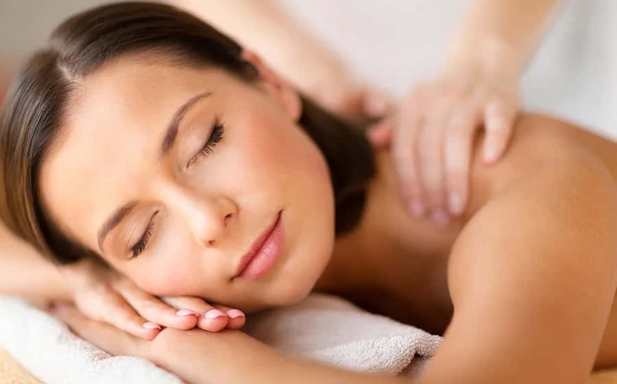 A Woman Getting A Back Massage At A Spa