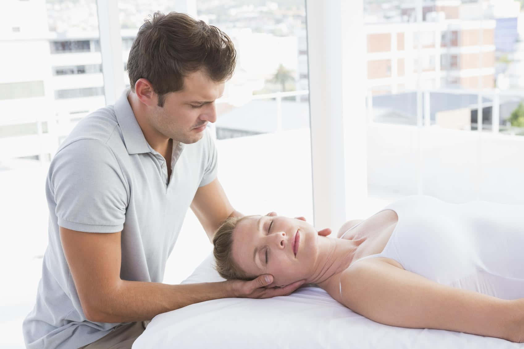 A Man Is Giving A Massage To A Woman Wallpaper