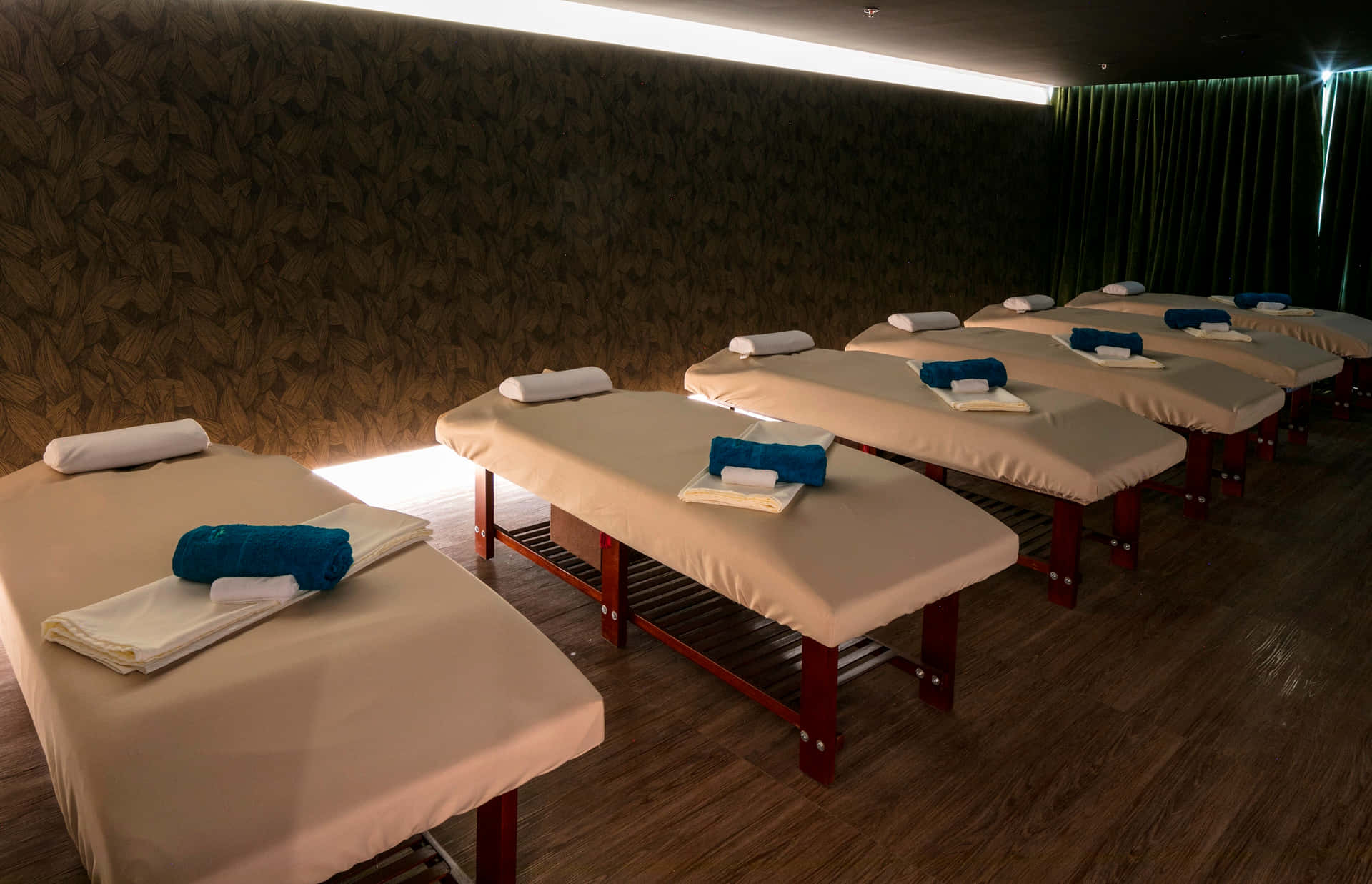 A Row Of Massage Beds Lined Up