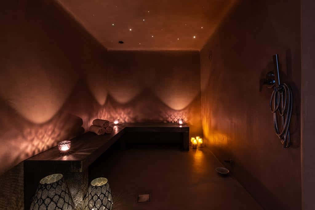 A Room With Candles And A Bathtub