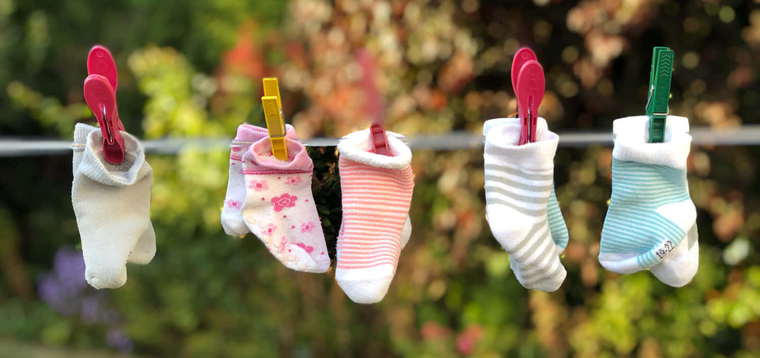 A Group Of Socks Hanging On A Clothes Line