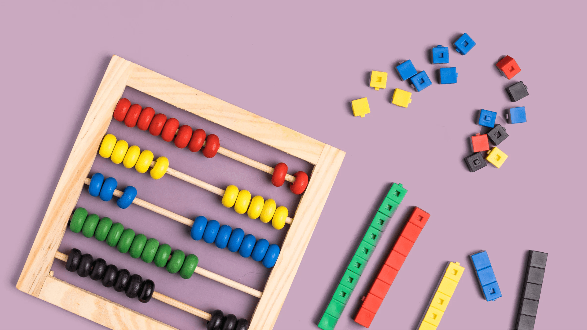 Countless Possibilities Background — A wooden abacus with colorful beads sits beside scattered rainbow-colored counting blocks on a soft purple background.