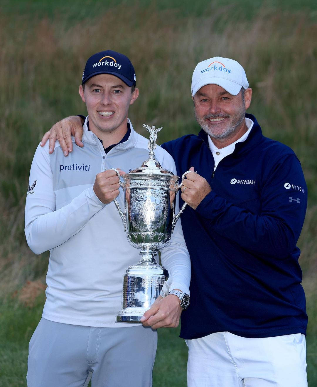 Matt Fitzpatrick And Billy Foster Holding Trophy Background