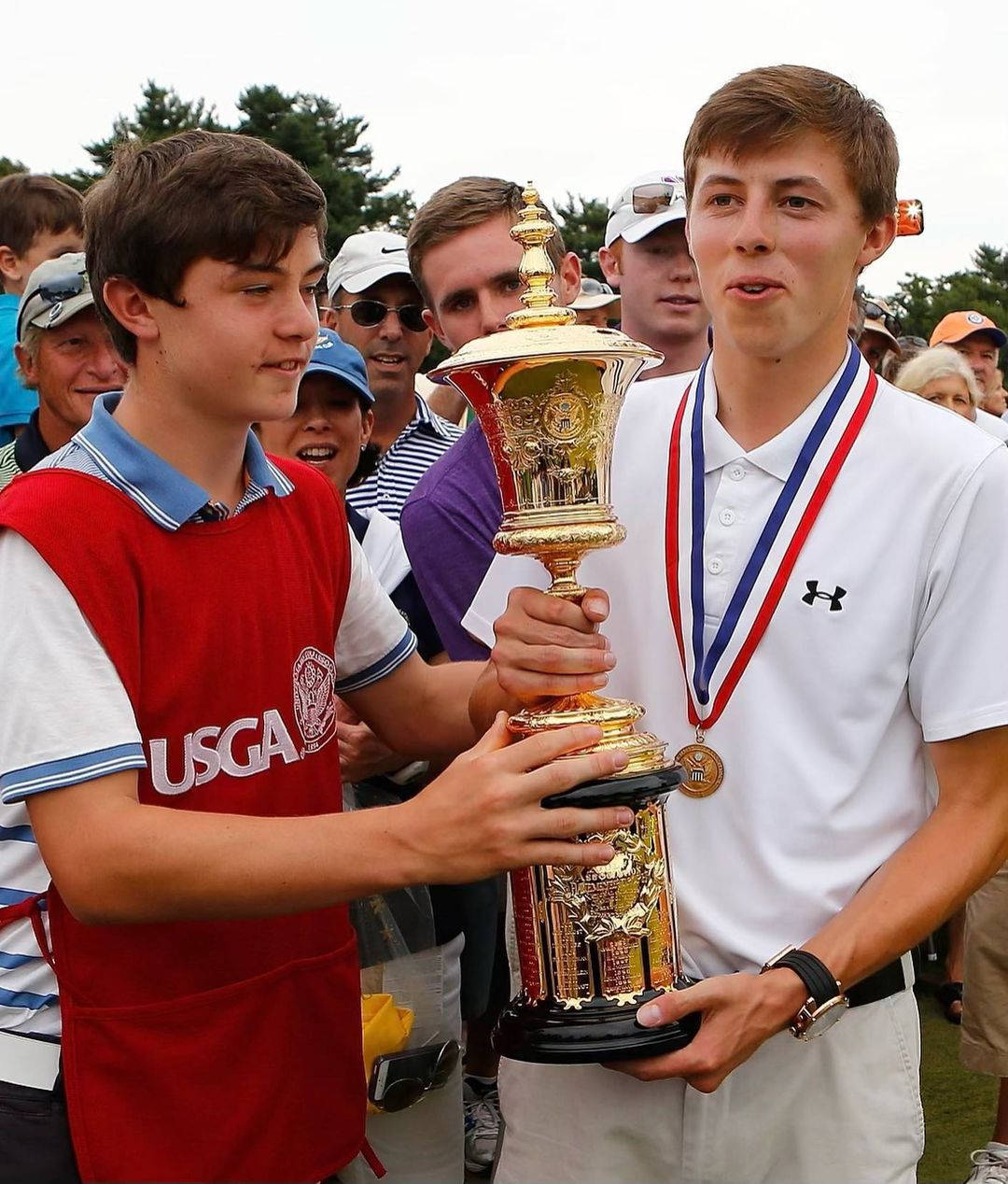 Matt Fitzpatrick And Brother Hold Trophy Background