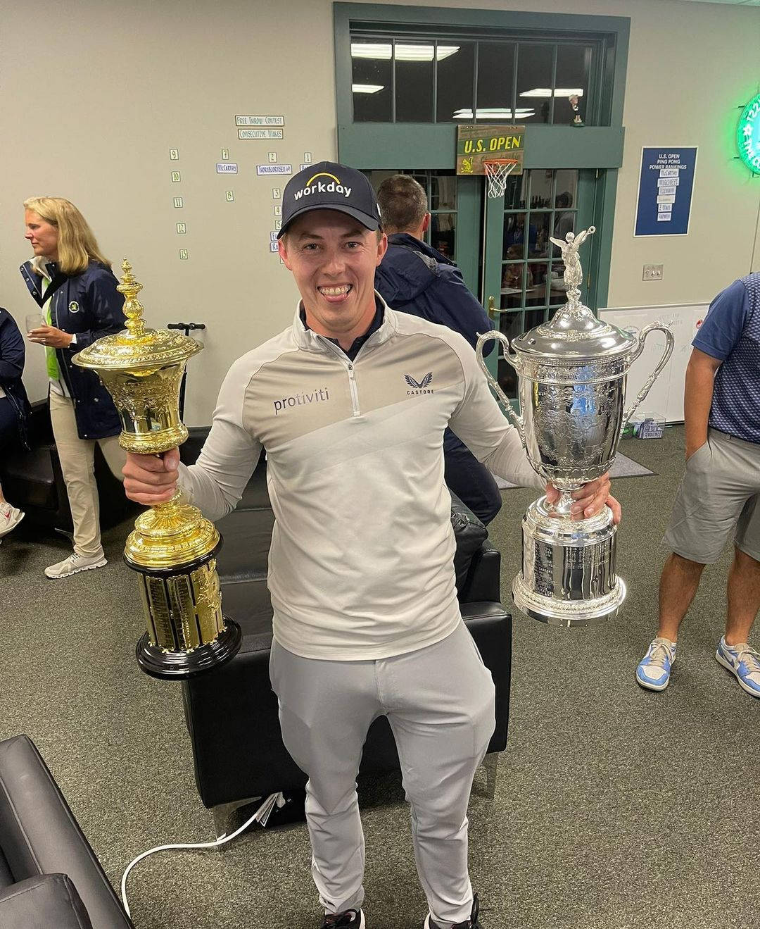 Champion golfer Matt Fitzpatrick enjoys his victory by holding two trophies Wallpaper