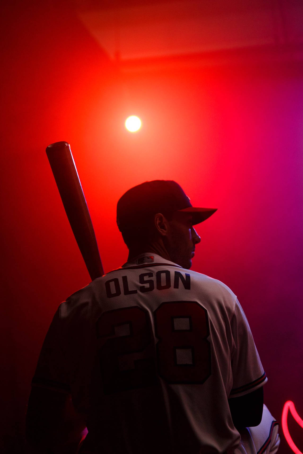 Matt Olson Holding Bat Red Light Wallpaper
