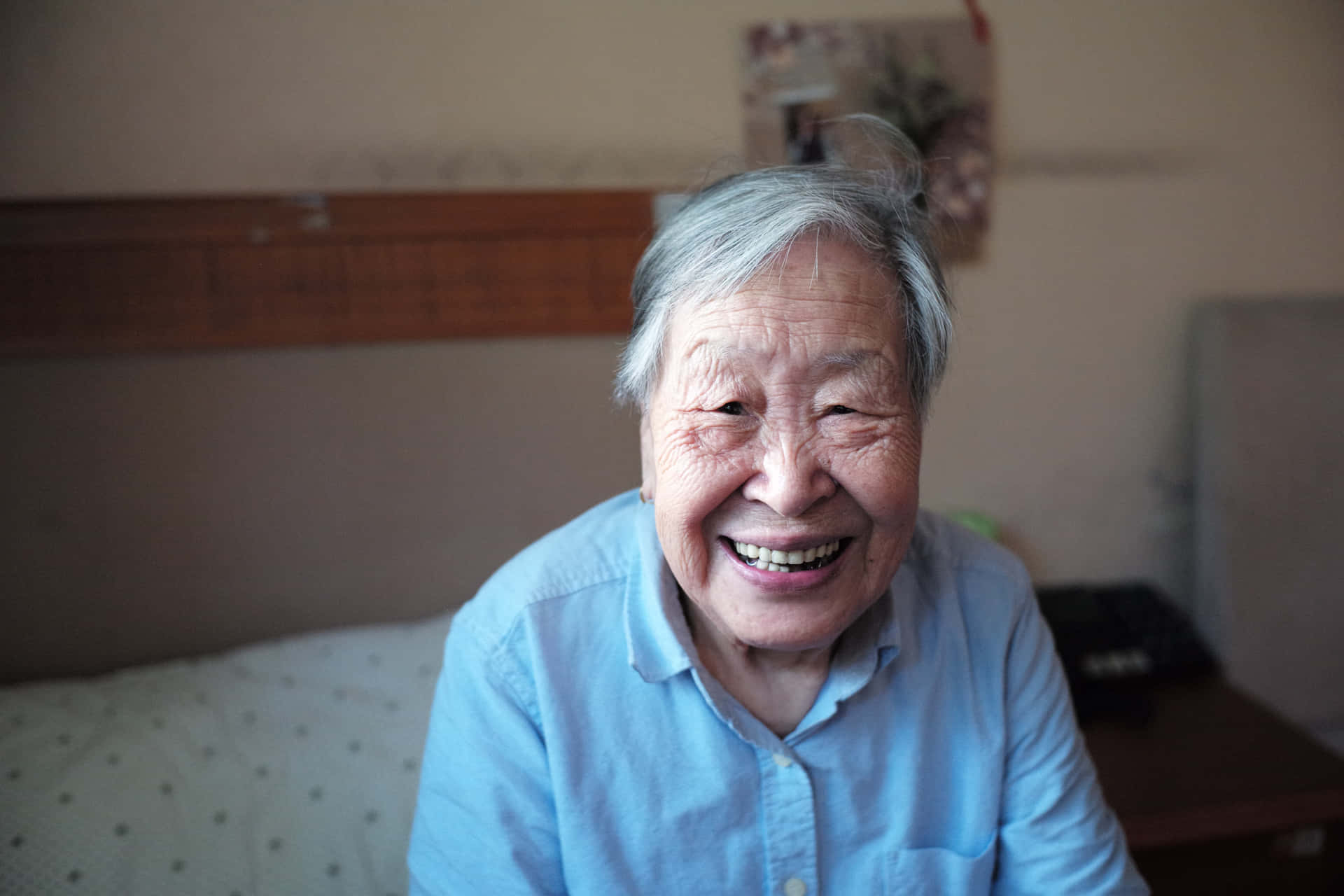 Mature Asian Woman Smiling Wallpaper