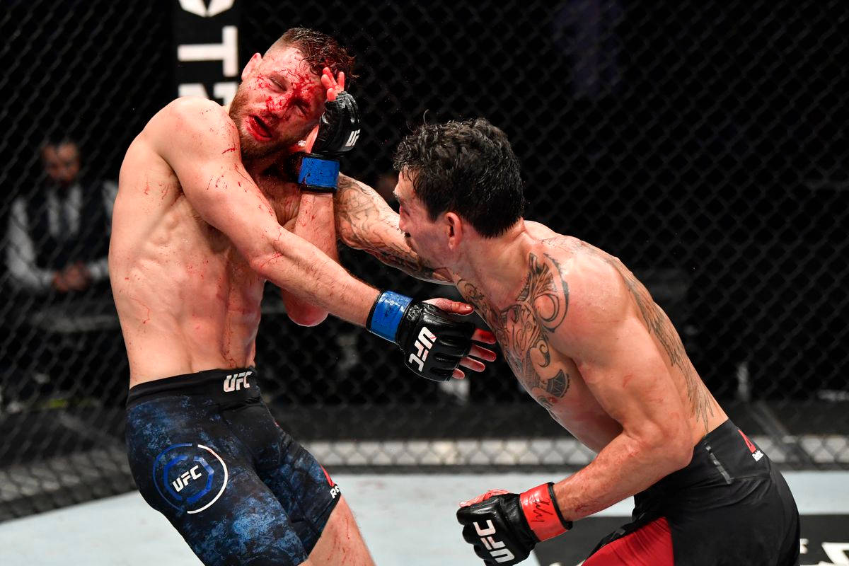 Max Holloway Attacking Bloody Opponent Wallpaper