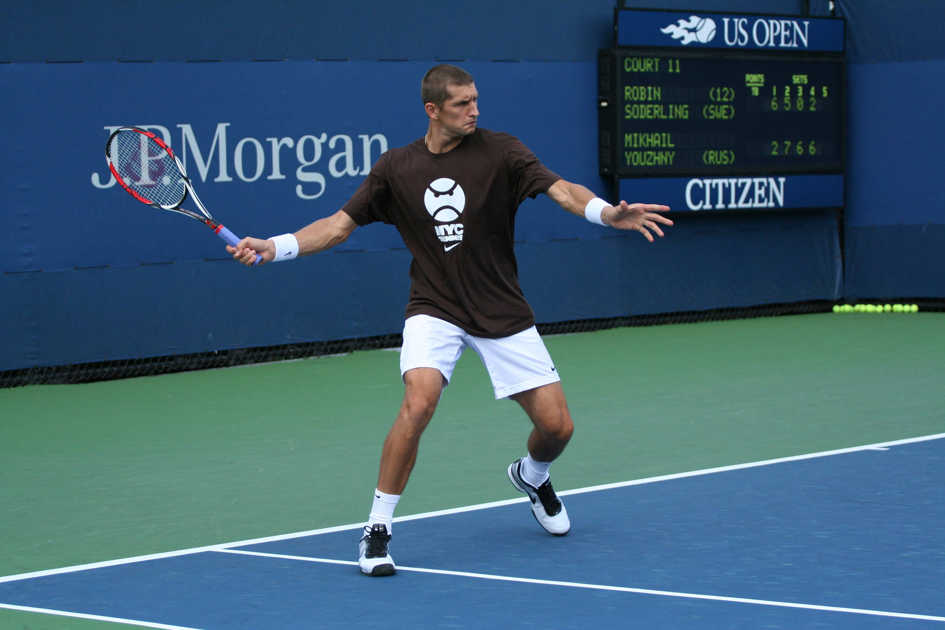 Max Mirnyi executing a strategic angling shot during the US open match Wallpaper