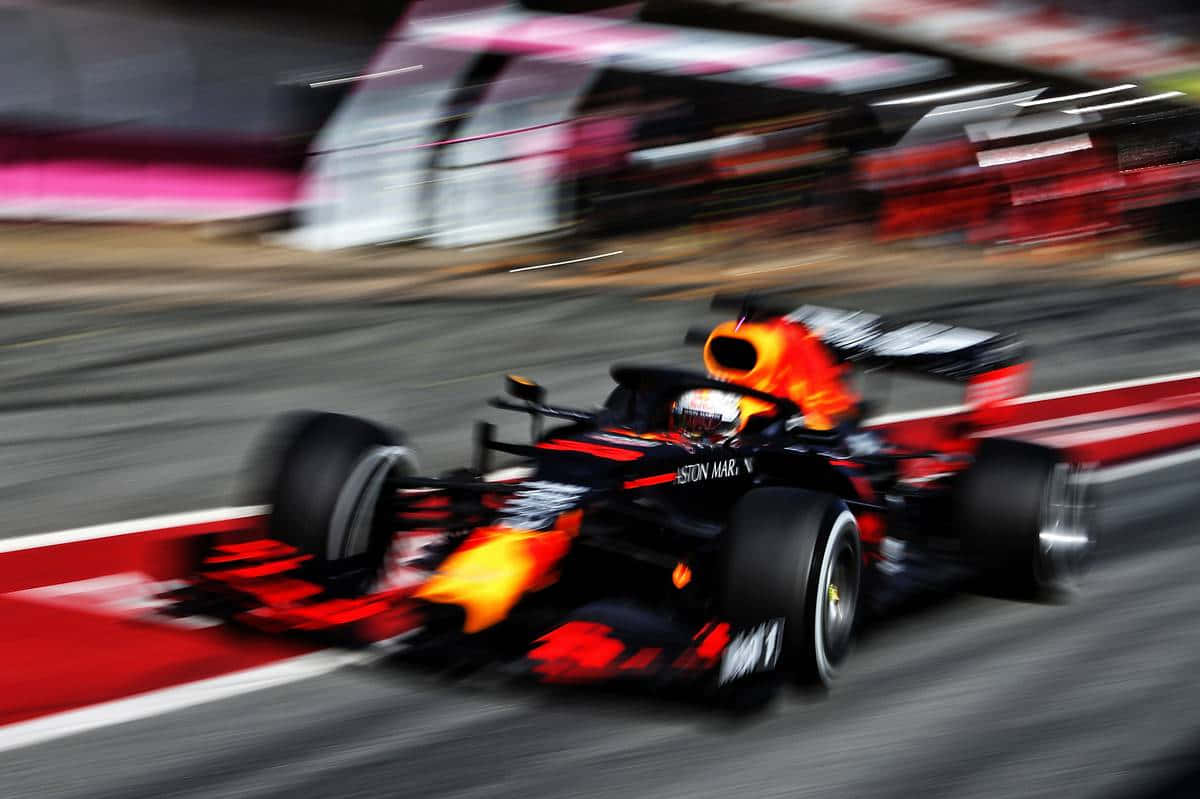 Max Verstappen racing at top speeds with his Red Bull Racing car