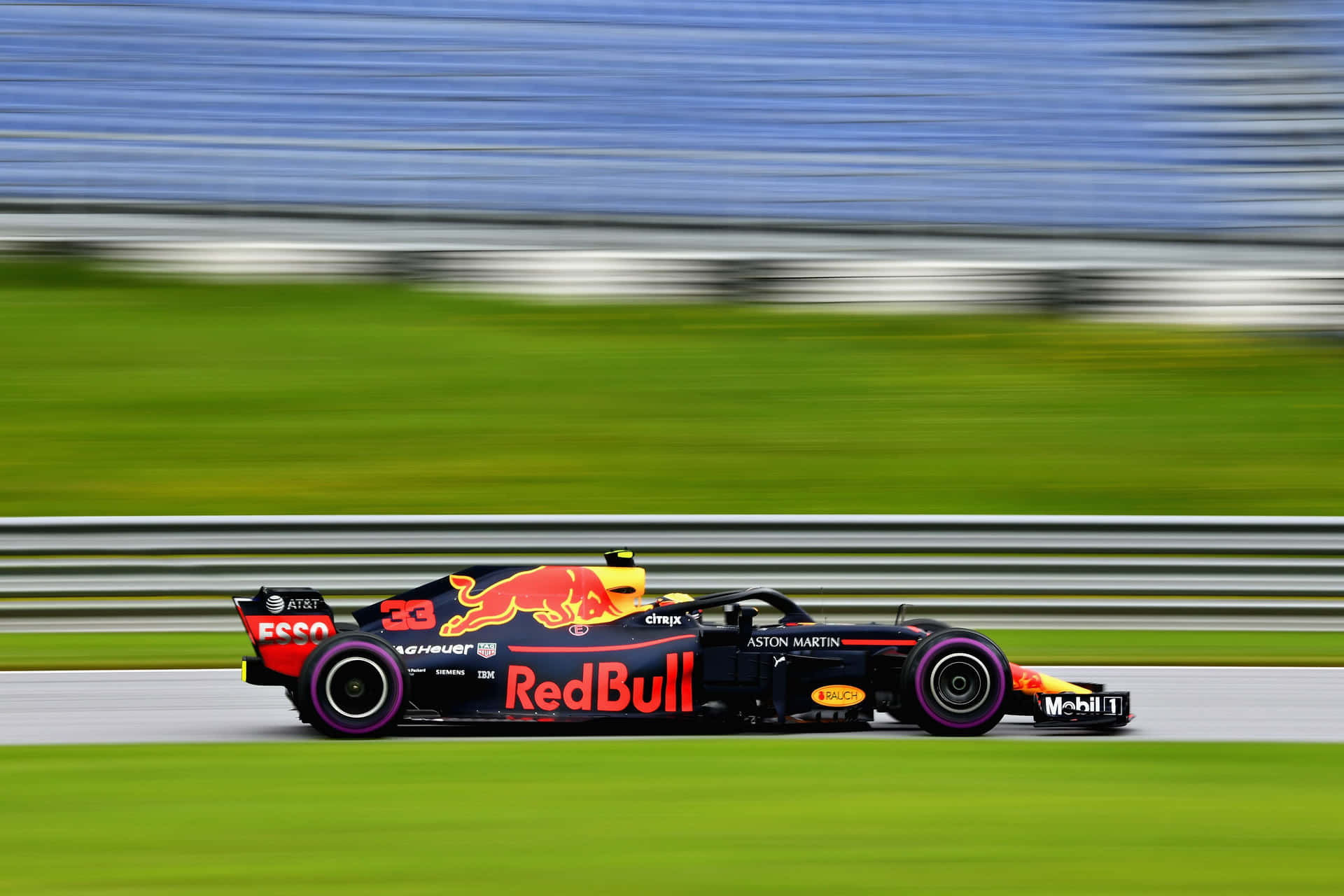 Max Verstappen racing on the Formula 1 track in his Red Bull car