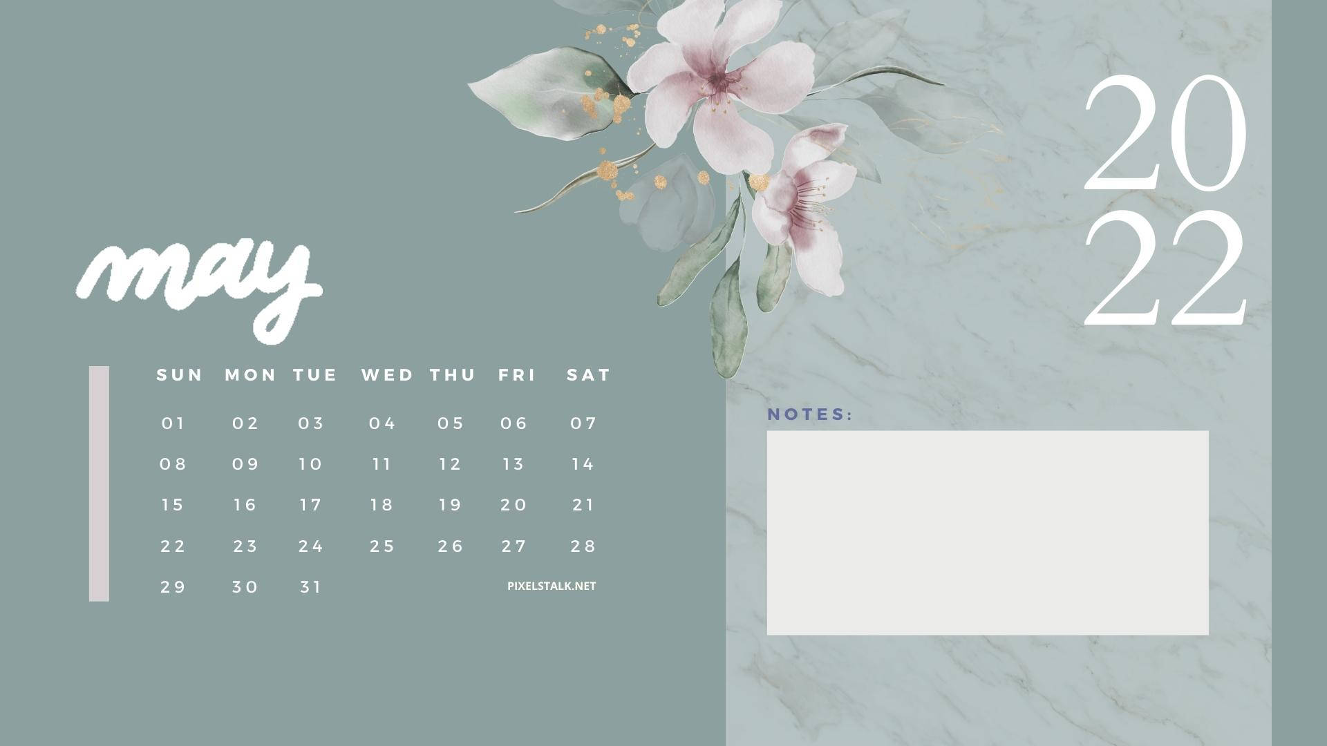 En kalender med blomster og en blå baggrund Wallpaper