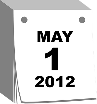 Une page de calendrier en papier datée du 1er mai 2012 avec des trous pour la reliure.