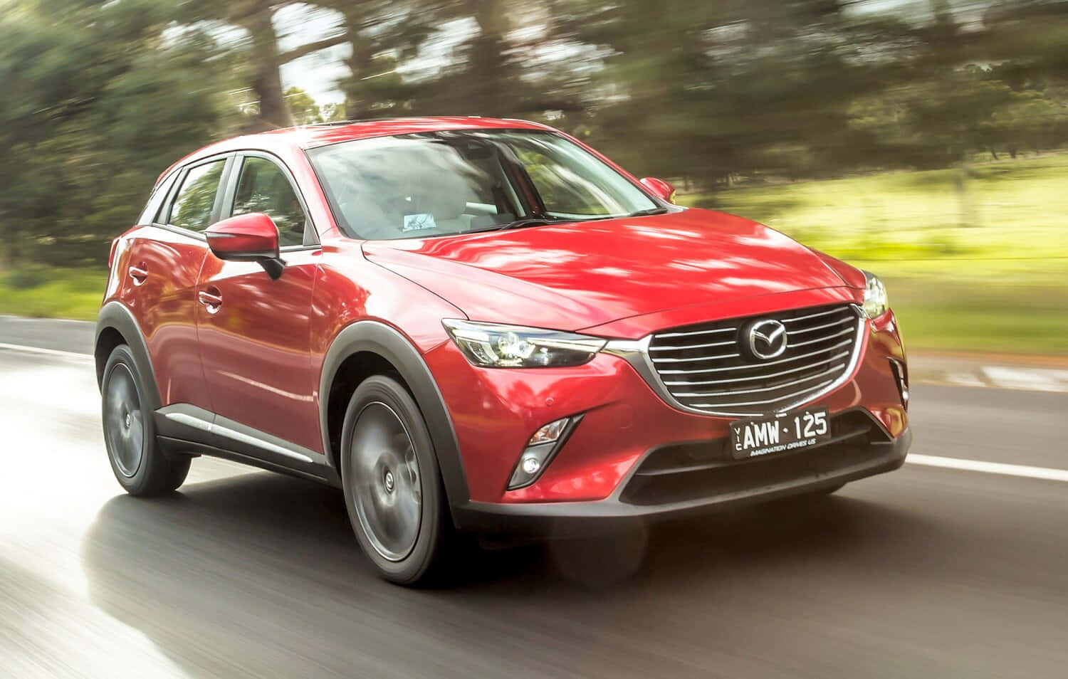 Sleek Red Mazda CX-3 in Urban Environment Wallpaper