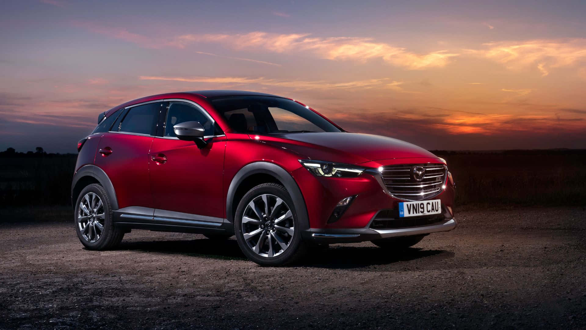 Sleek and sophisticated Mazda CX-3 on the open road Wallpaper