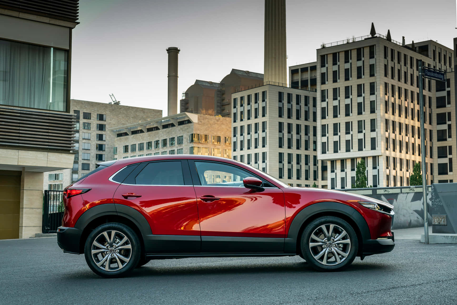 Sleek Mazda CX-30 in stunning landscape Wallpaper