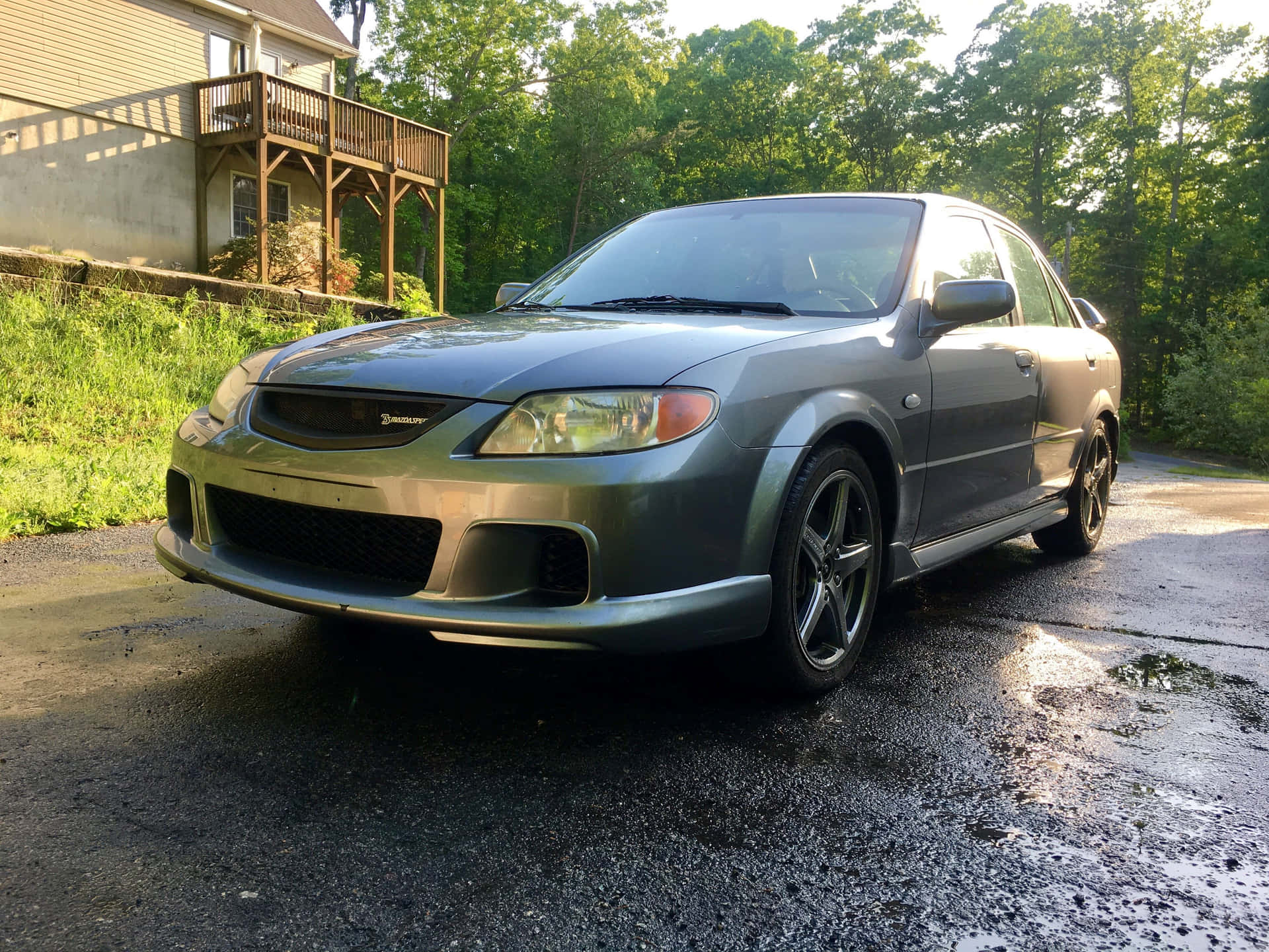 Stunning Mazda Protege in a Picturesque Landscape Wallpaper