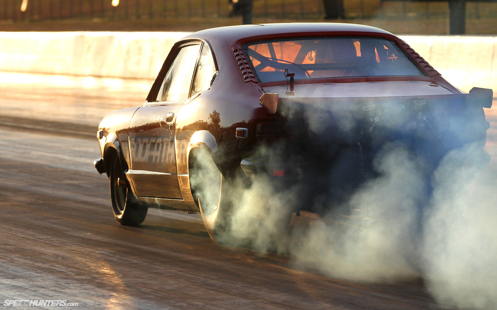 Intense Thrill with Mazda RX-3 Drag Racing Wallpaper