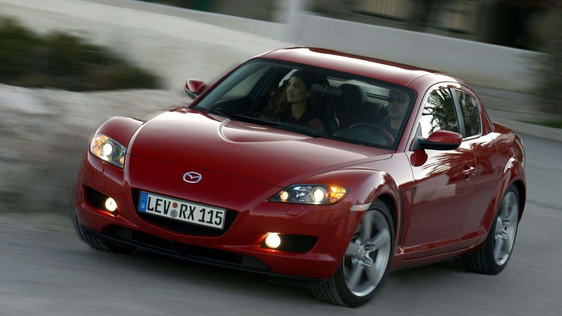 Sleek and Stylish Mazda RX-8 in Action Wallpaper