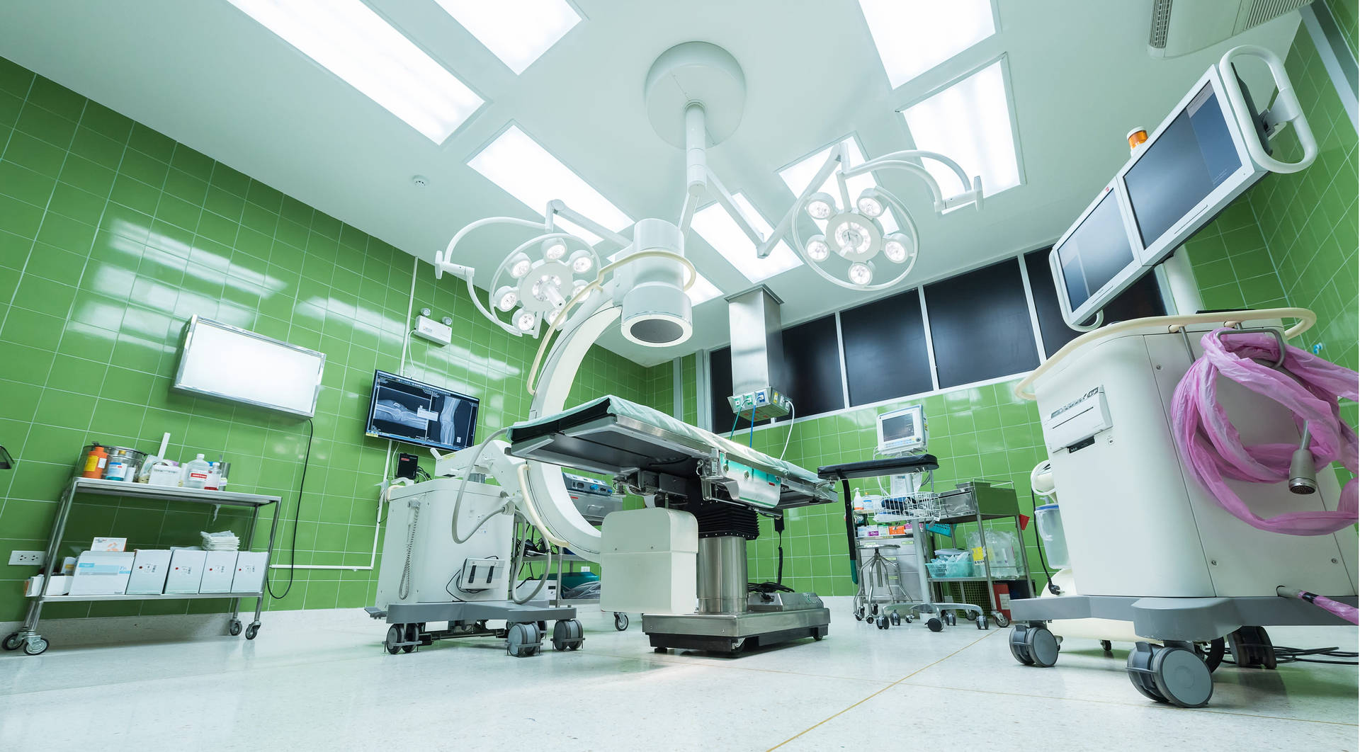 Skilled Entrepreneurs Operate in a Modern MBBS Operating Room Wallpaper