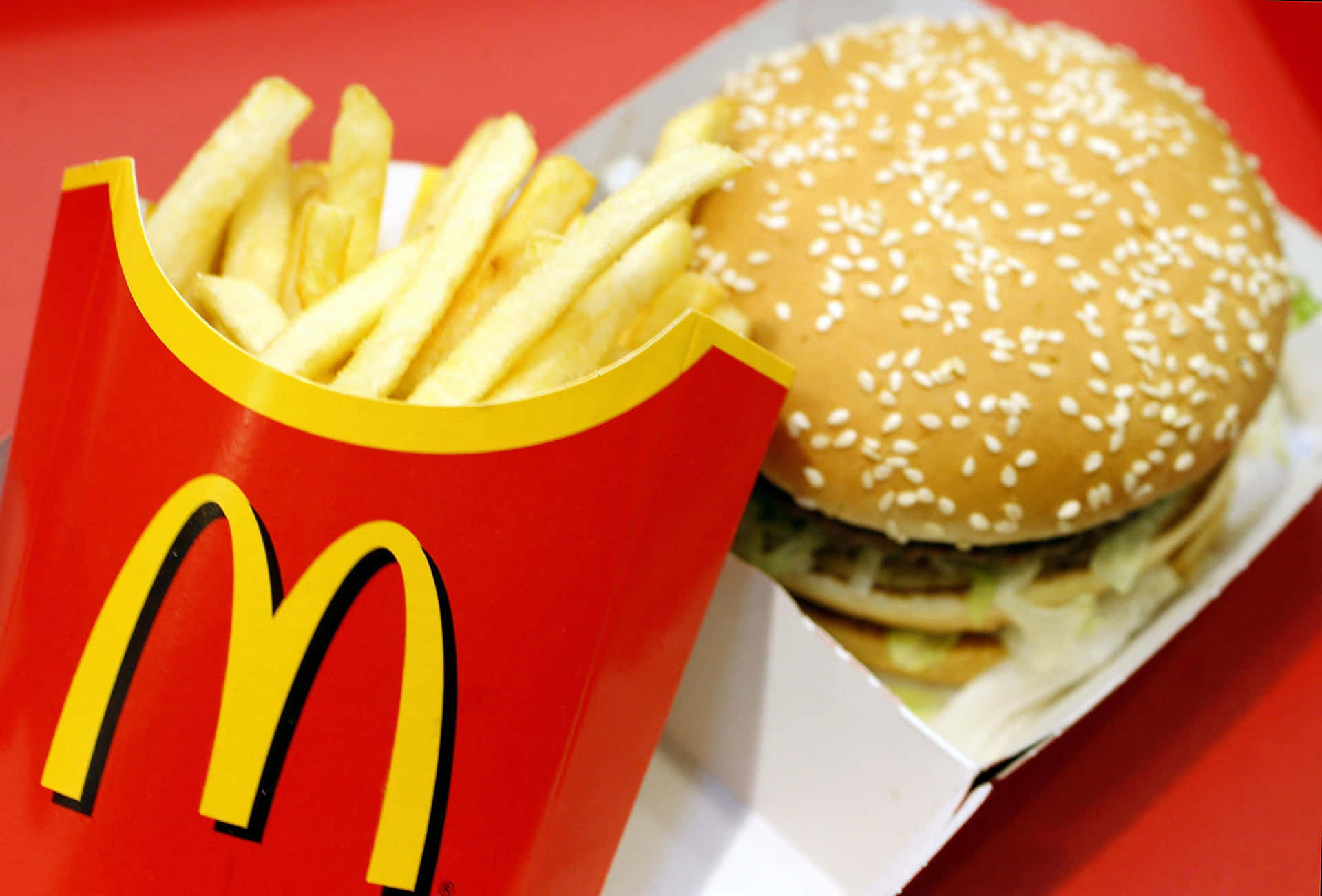 A Mcdonald's Hamburger And French Fries Are Shown
