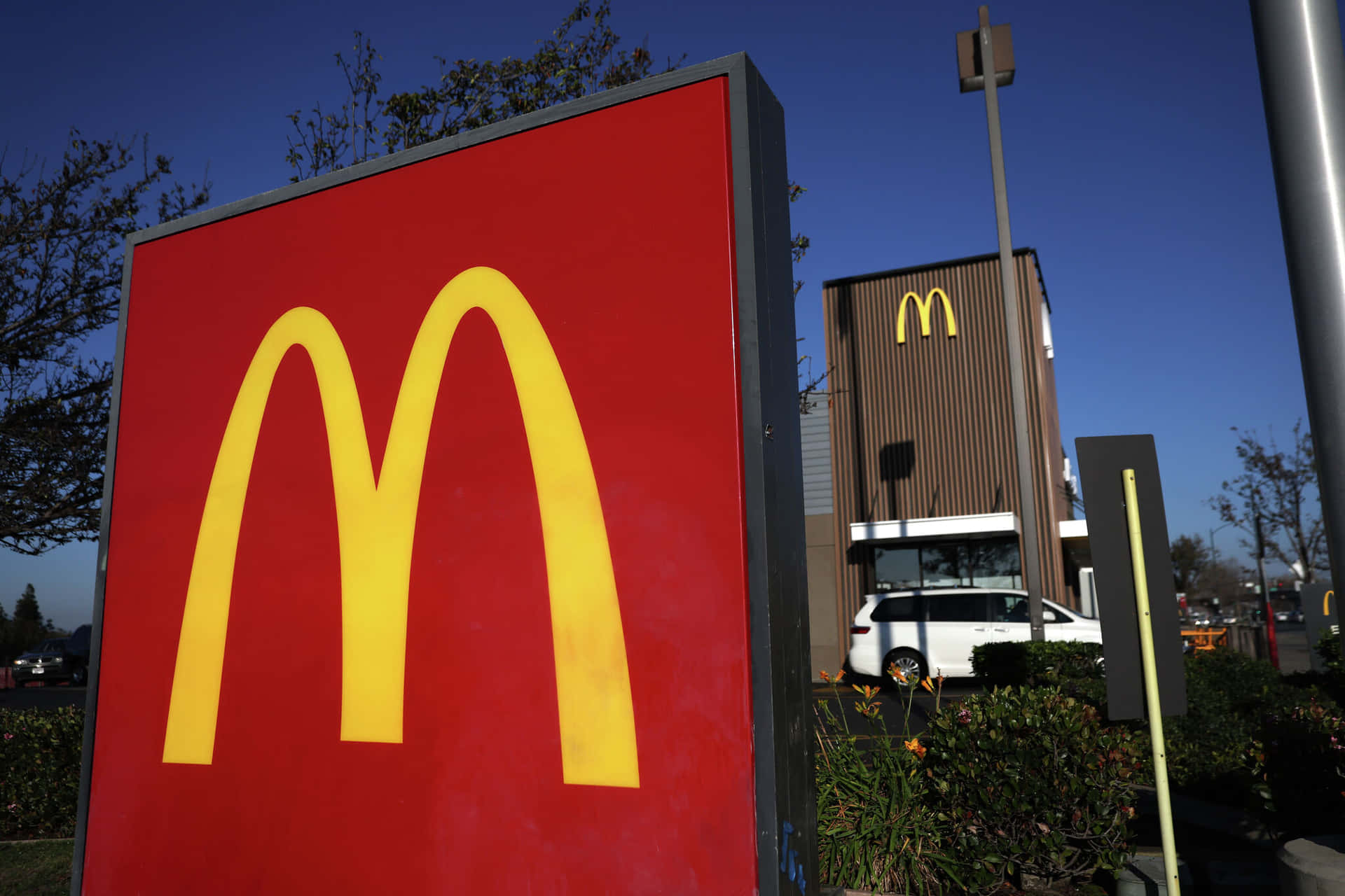 A Mcdonald's Sign Is Seen In Front Of A Building