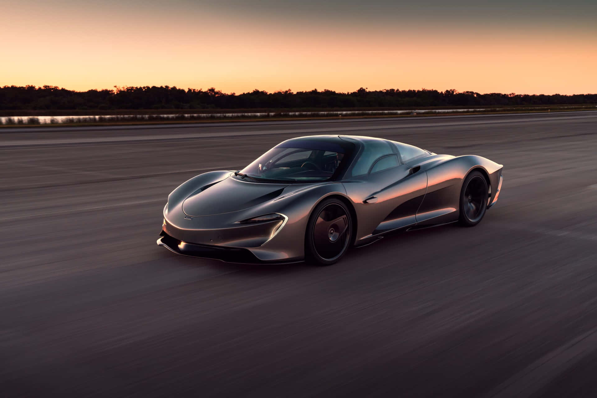 Captain: A stunning McLaren sports car showcased against a picturesque landscape.