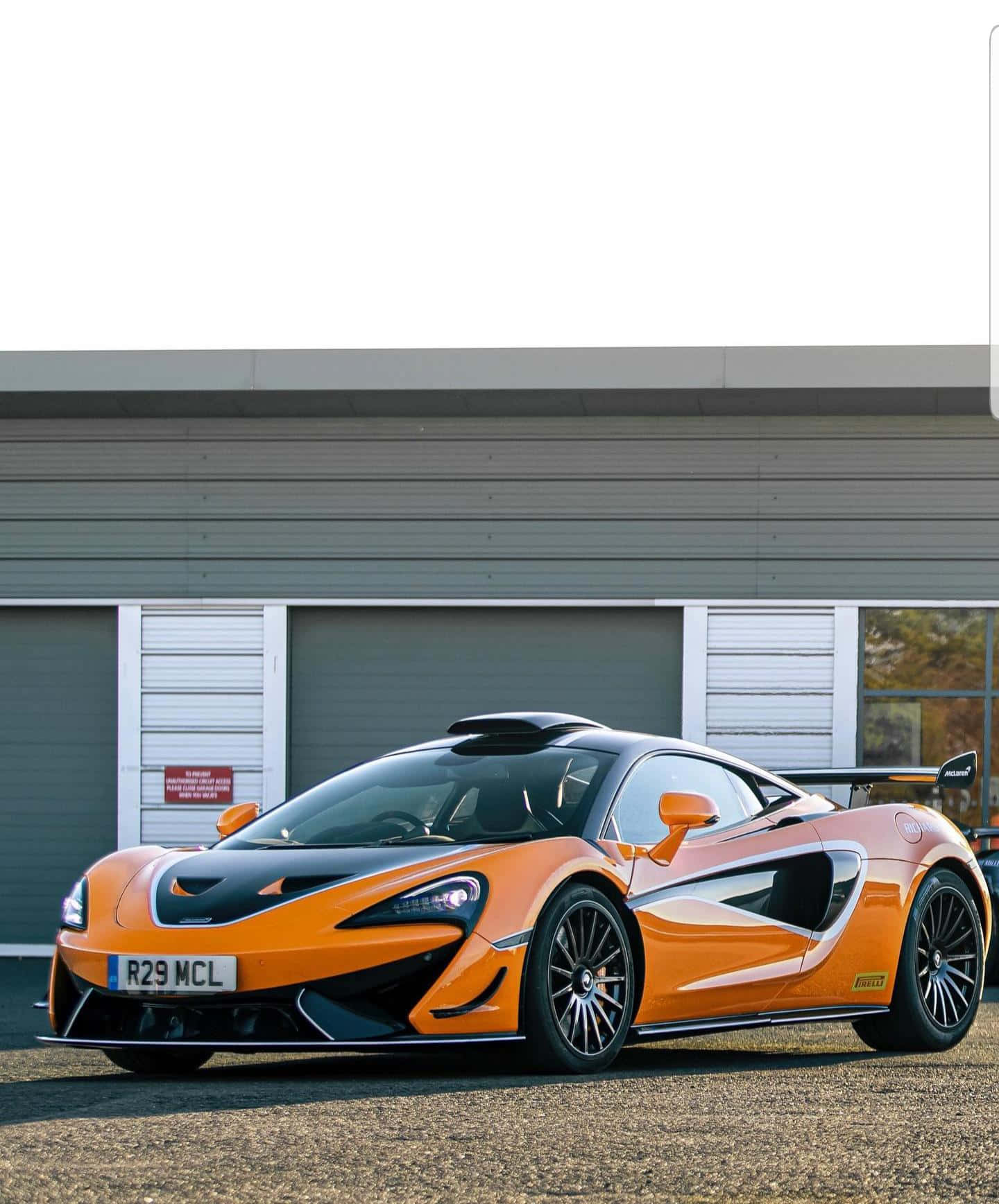 The McLaren 620R posing on the race track Wallpaper