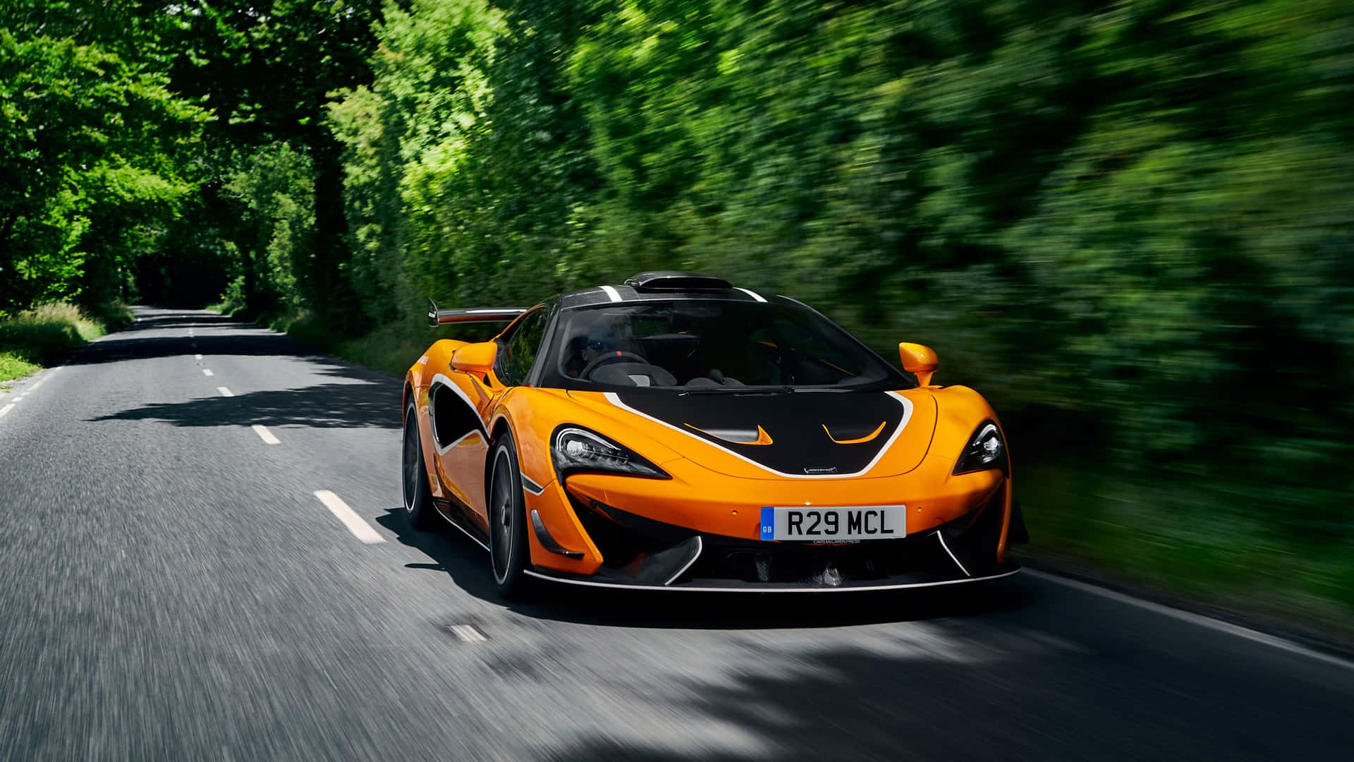 A stunning McLaren 620R showcasing its sleek design and impeccable performance Wallpaper