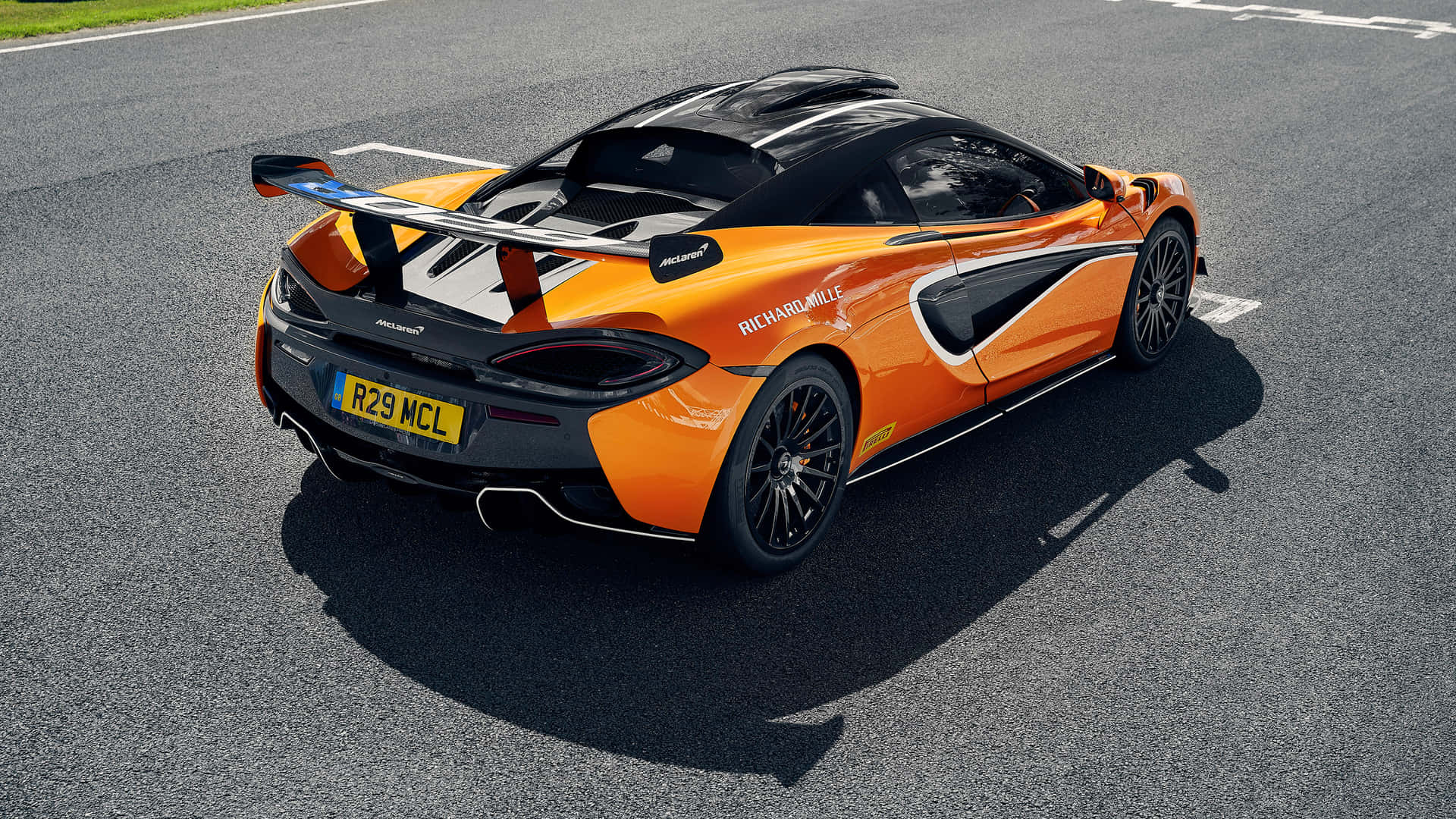 Caption: Stunning McLaren 620R Dominating the Racetrack Wallpaper