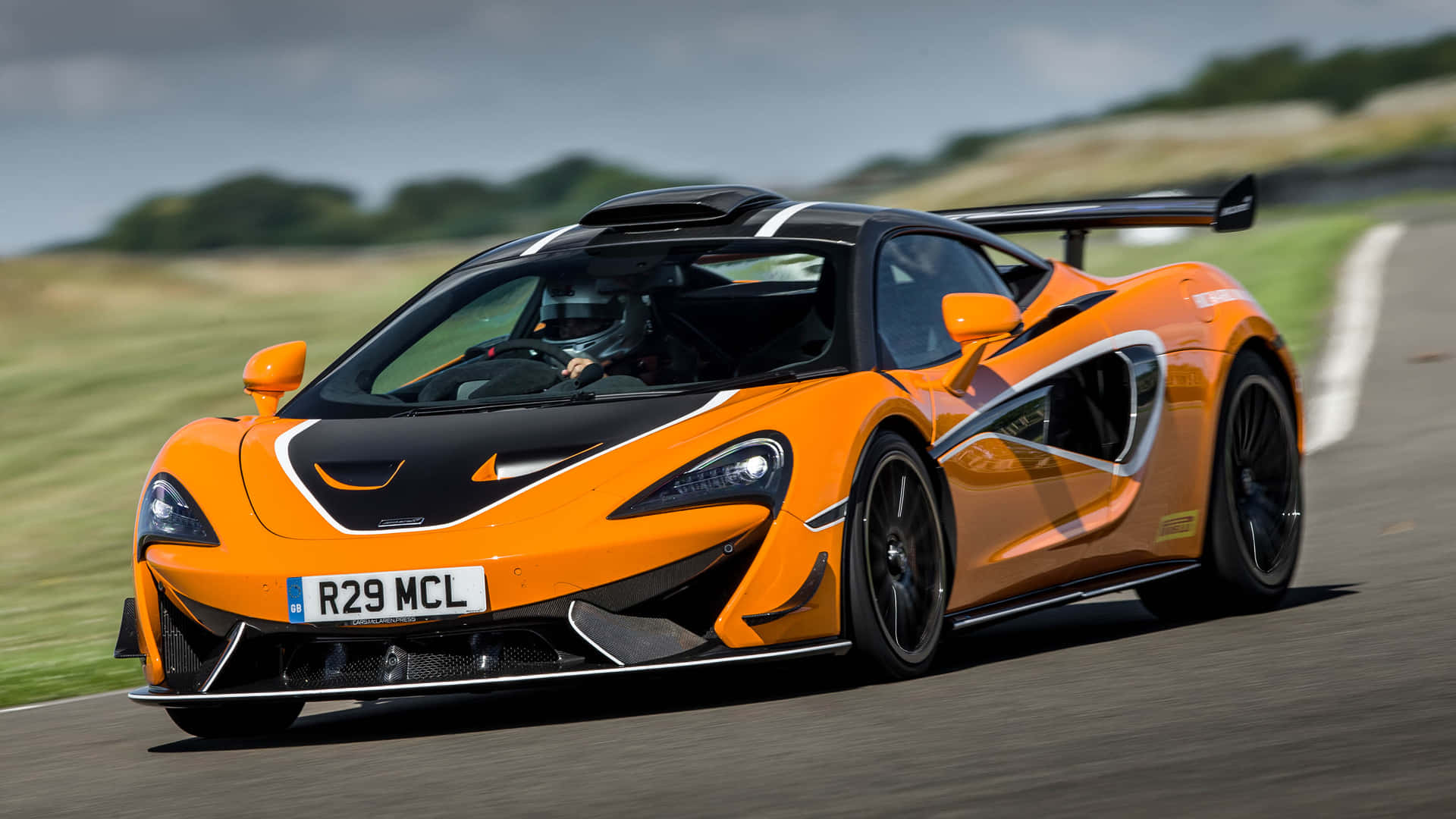 Captivating McLaren 620R on the Road Wallpaper