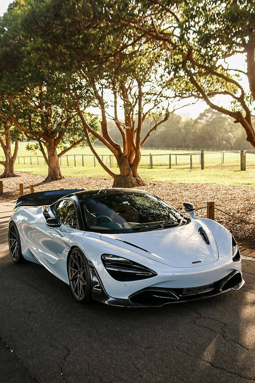 Mclaren 720s White Car By Trees Phone Background