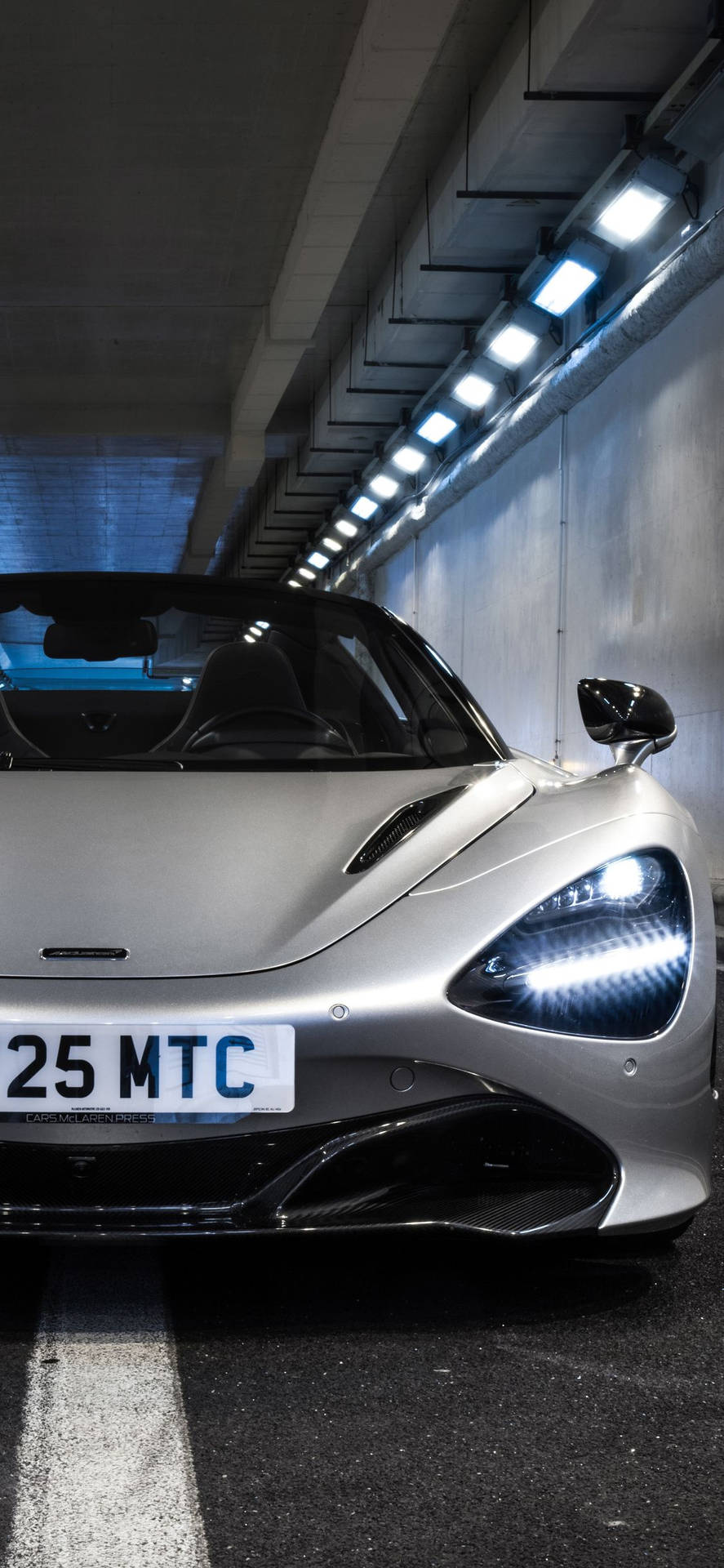 Mclaren 720s White Car In Tunnel Phone Wallpaper
