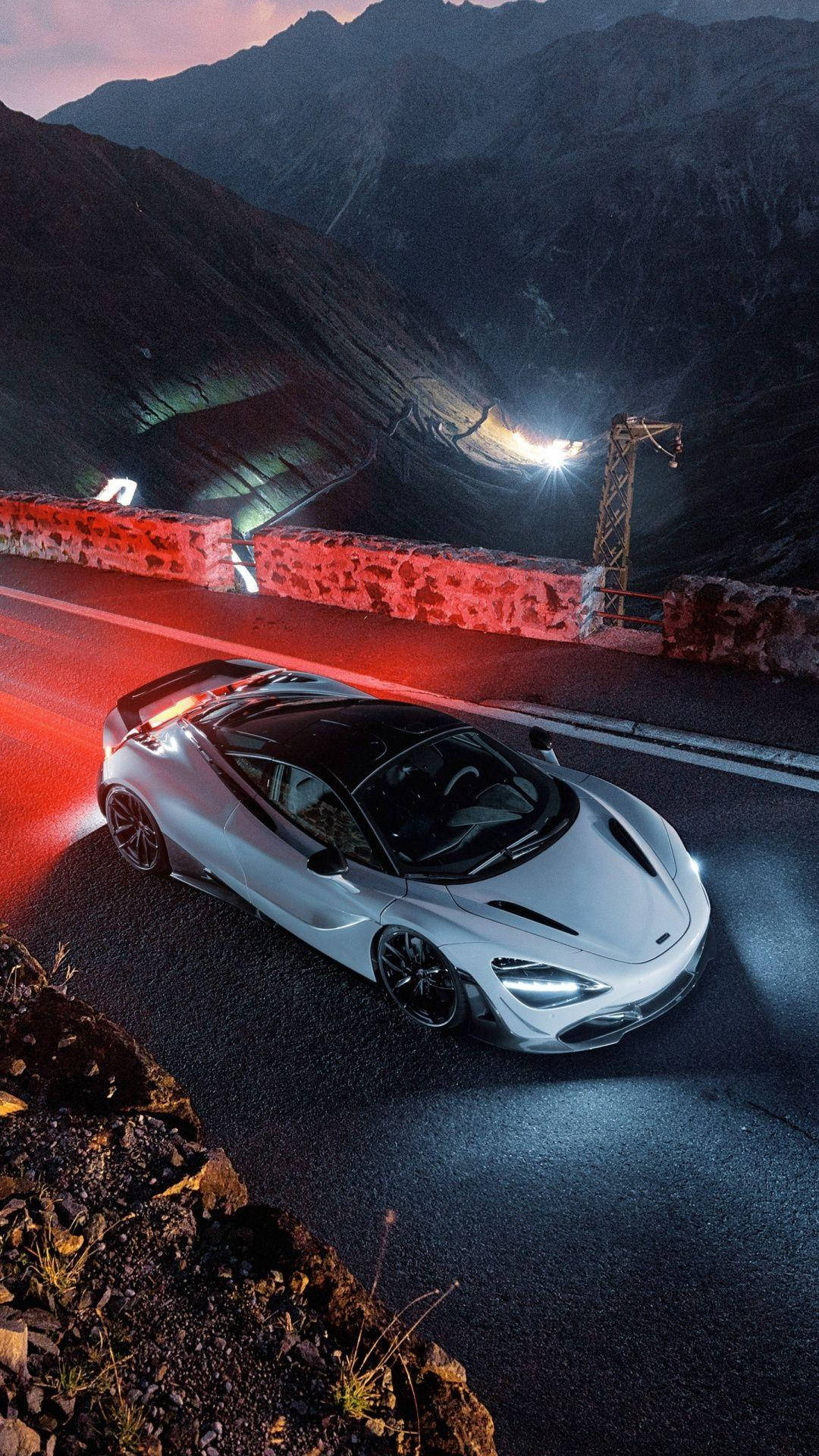A Mclaren 720s Showcased In All Its Magnificence Under Aesthetic Lighting Wallpaper