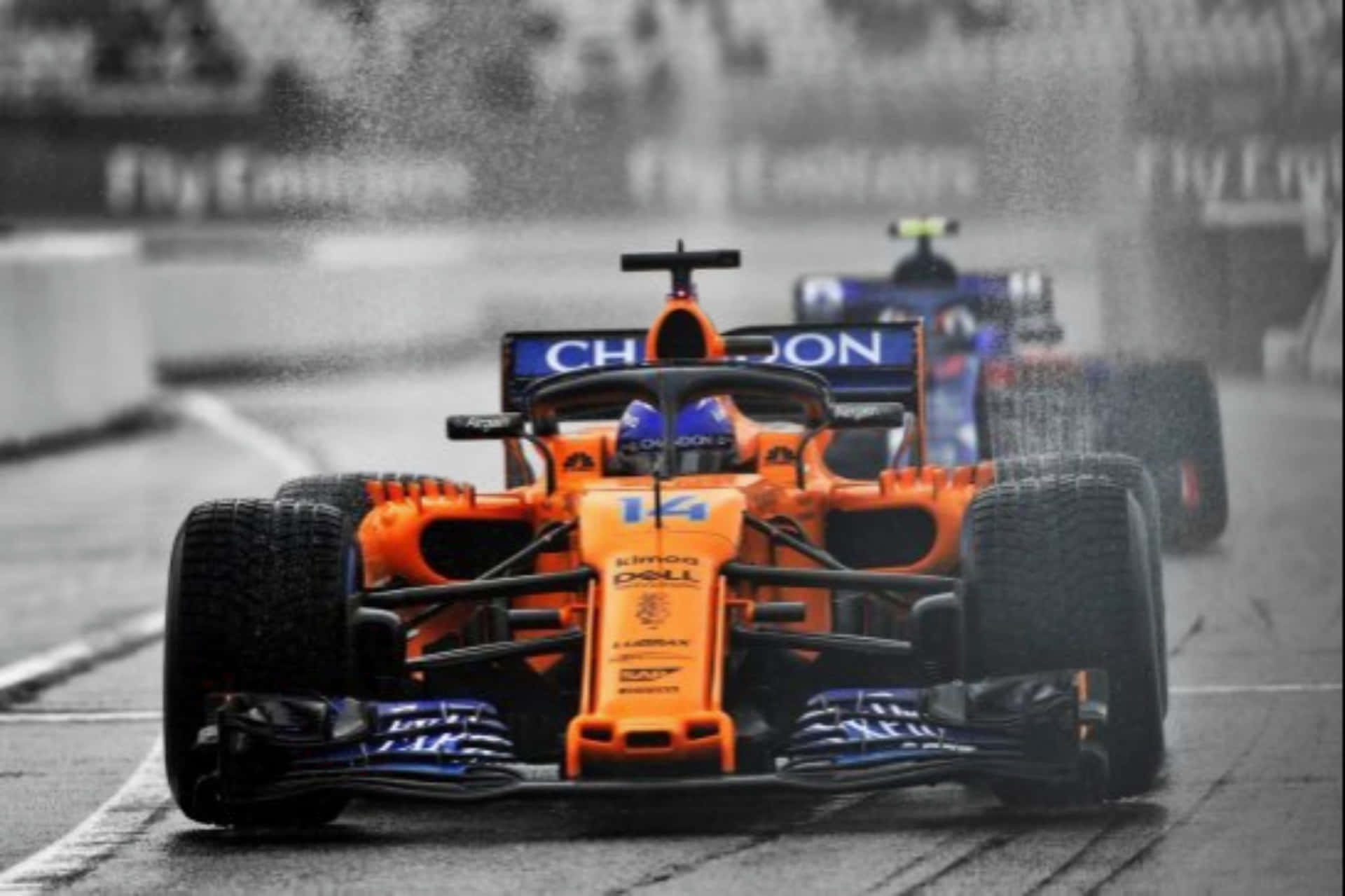 Fernando Alonso driving a Mclaren Formula 1 car Wallpaper
